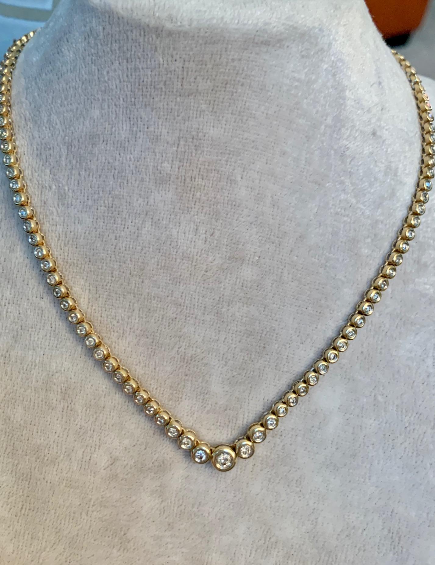 This beautiful 14k yellow Gold tennis necklace is absolutely stunning!  There 110 brilliant cut Diamonds which circle completely around the 16
