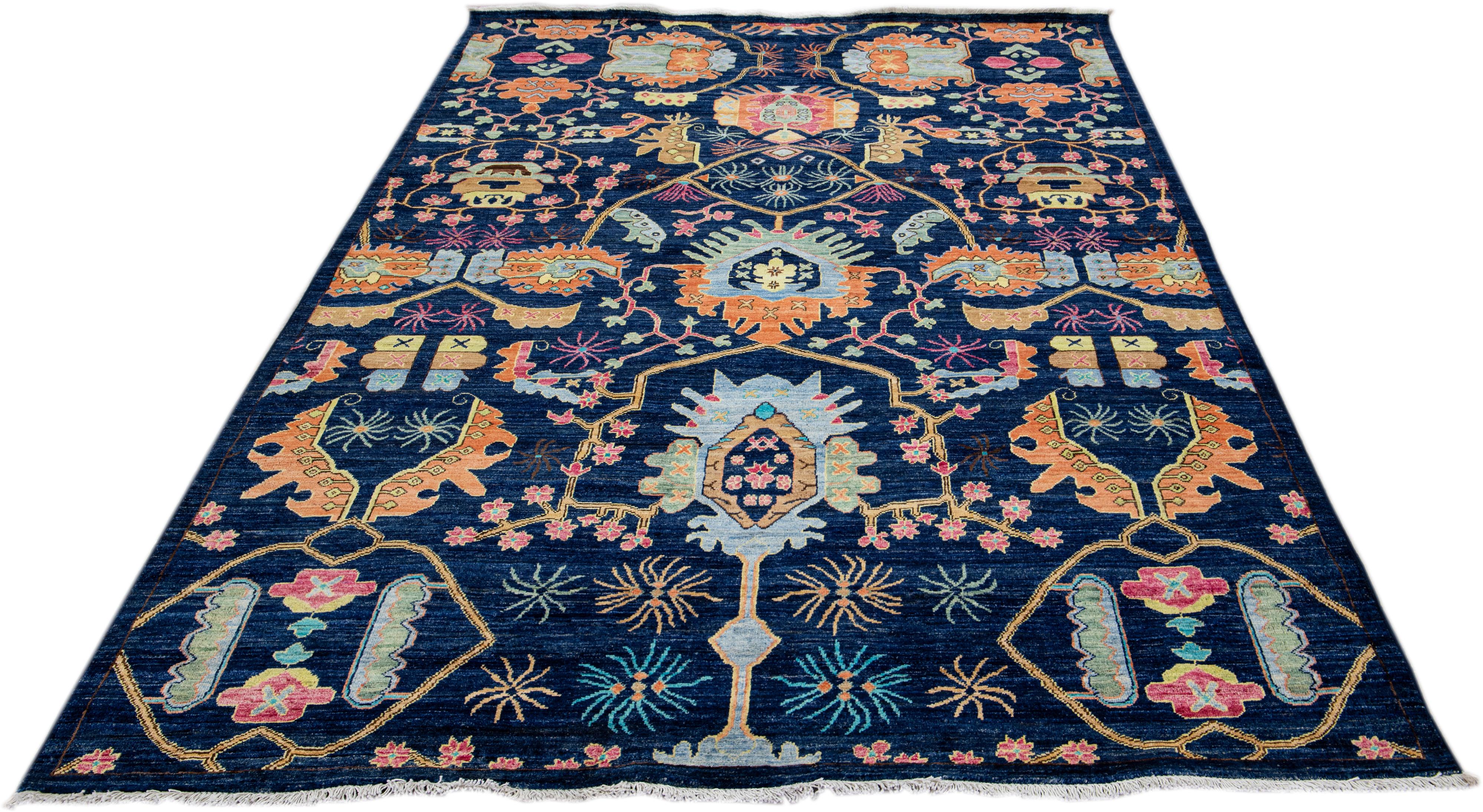 Beautiful modern Bidjar Style hand-knotted wool rug with a navy-blue field. This piece has multicolor accents that feature a gorgeous geometric floral pattern design with white fringes.

This rug measures: 6'3