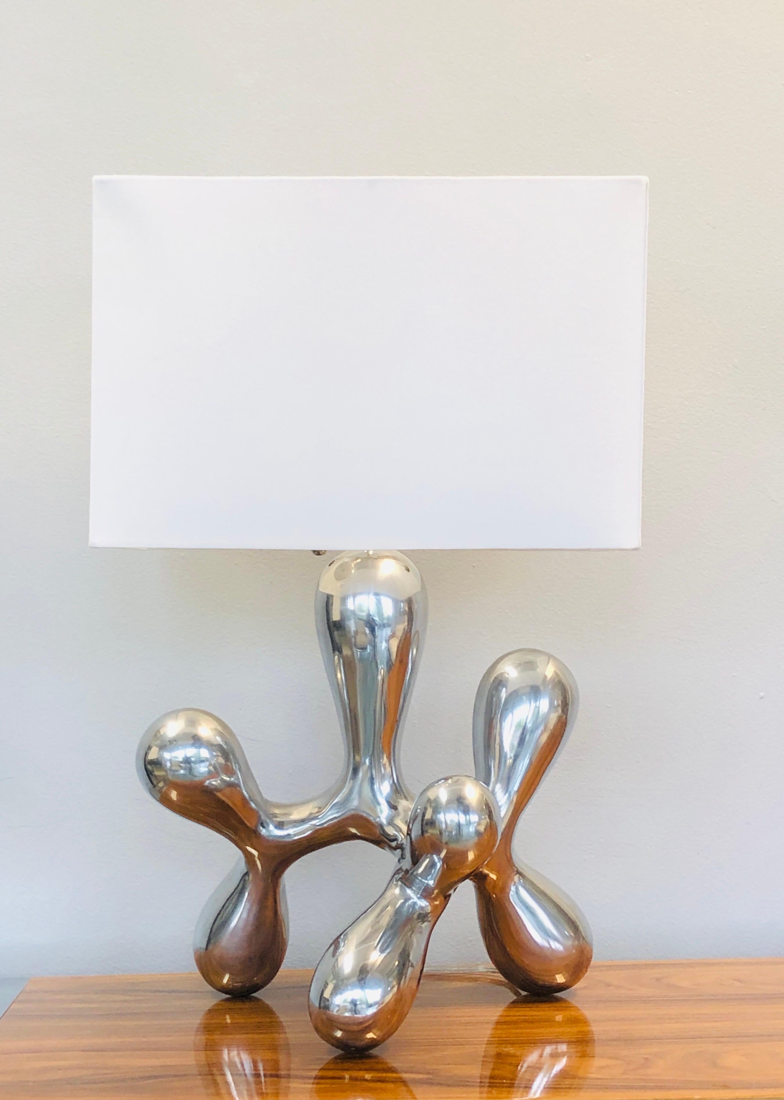 Abstract modern sculptural table lamp. Polished nickel finish.