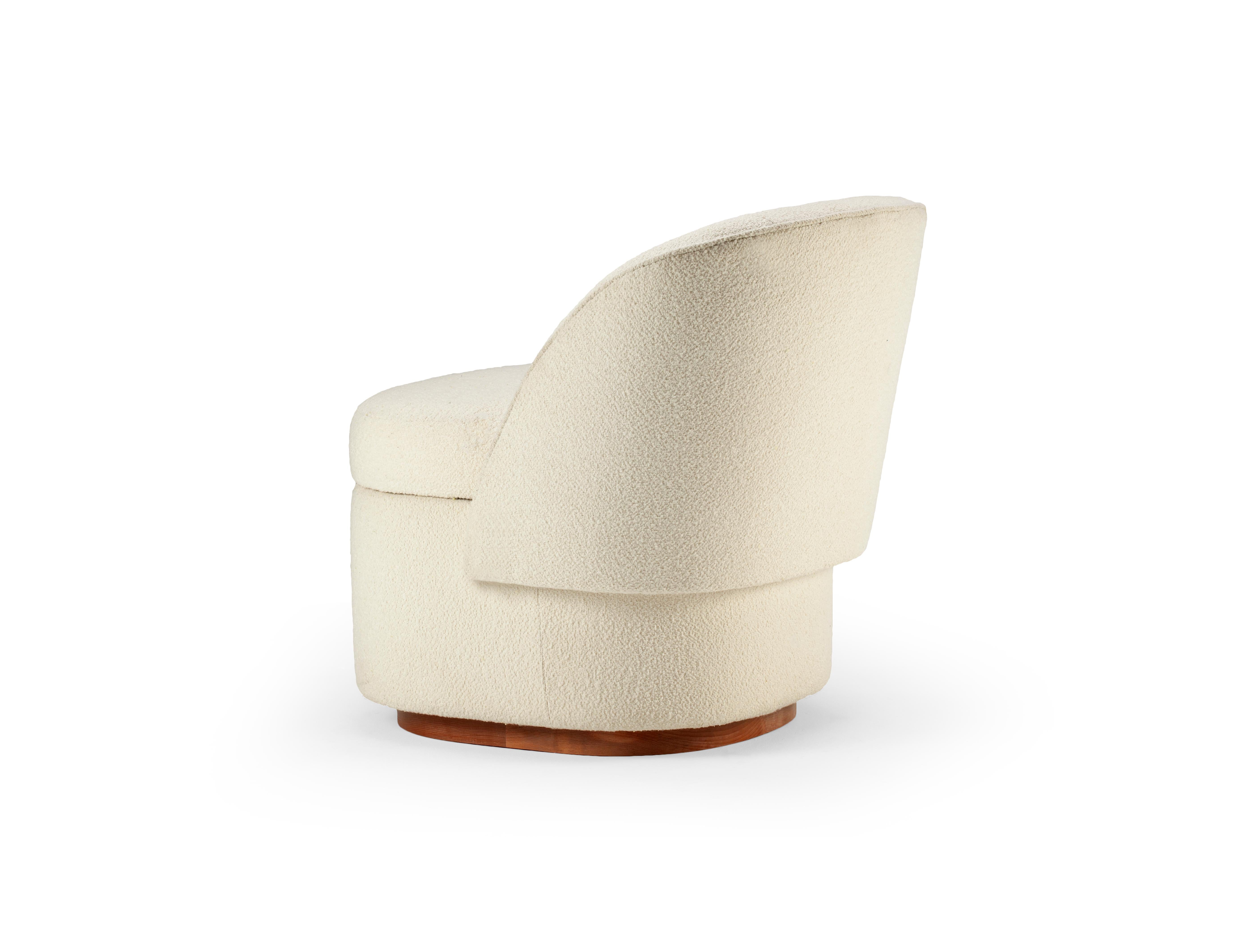 Swooping curves, softly returning arms, and sculptural shape define the Bisou Armchair. The tight but soft seat and back along with clean seam detailing give this piece a clean, tailored appearance, featuring incredibly comfortable upholstery and a