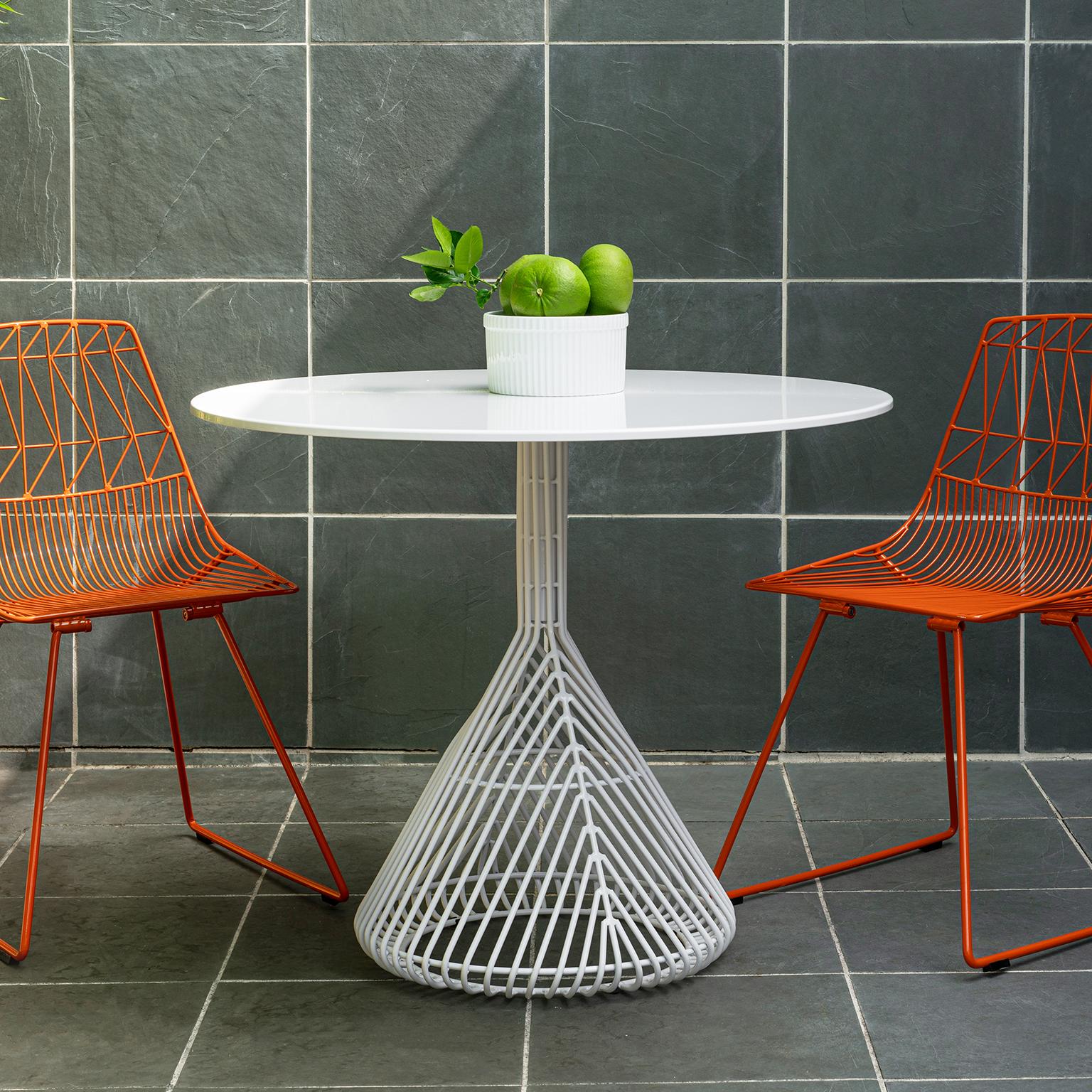 Bend Goods wire furniture
This modern wire dining table updates the outdoor bistro shape with a tightly knit base that is durable and sculptural. The bistro table is a callback to a Classic design with a contemporary twist that works inside or