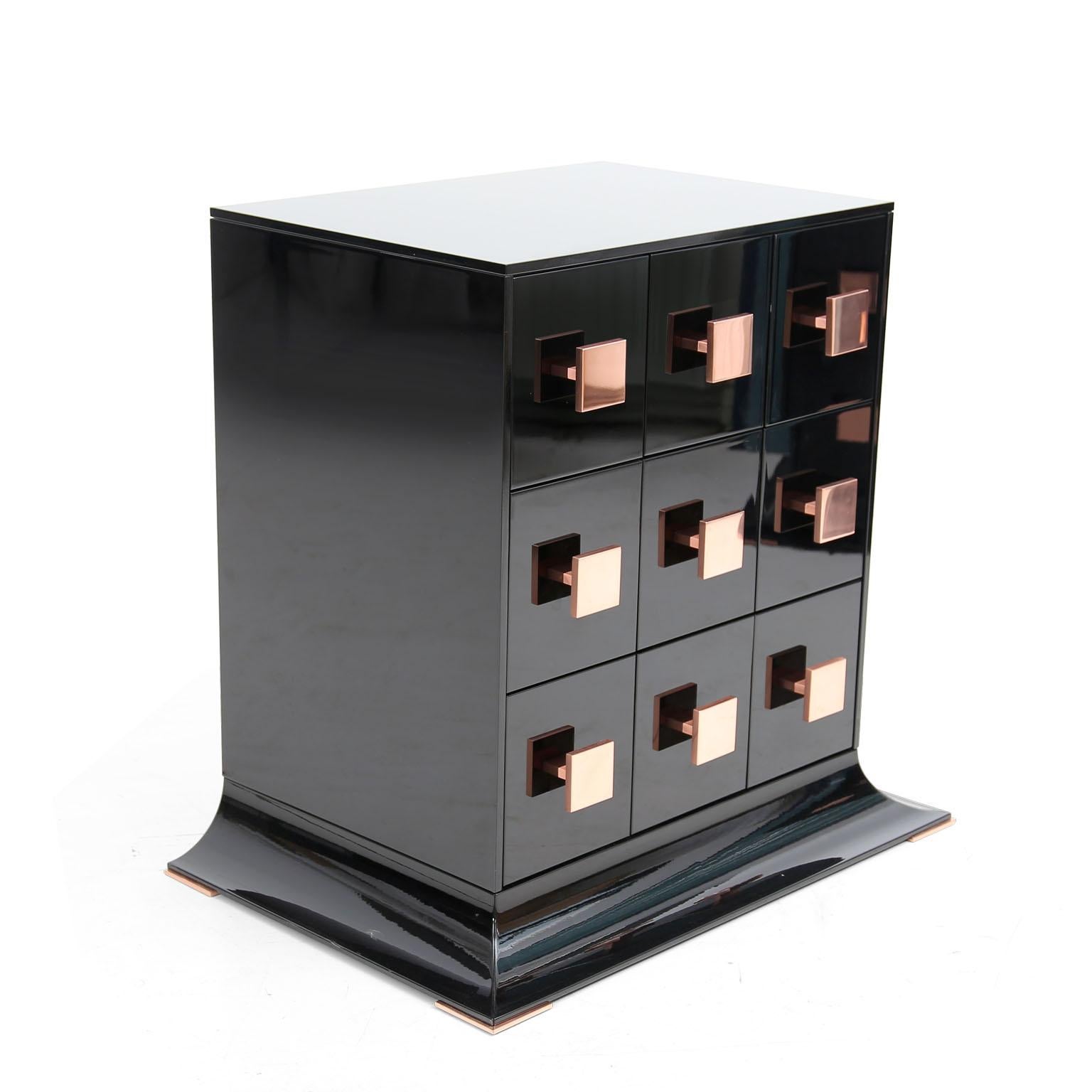 This cabinet is the ultimate in sleek glamour. Simple in Silhouette but rich in allure and appeal, the side table Polaris 9 drawers offers a delectable finishing touch to the high-fashion home.

Elevate the humble chest from simply a means of