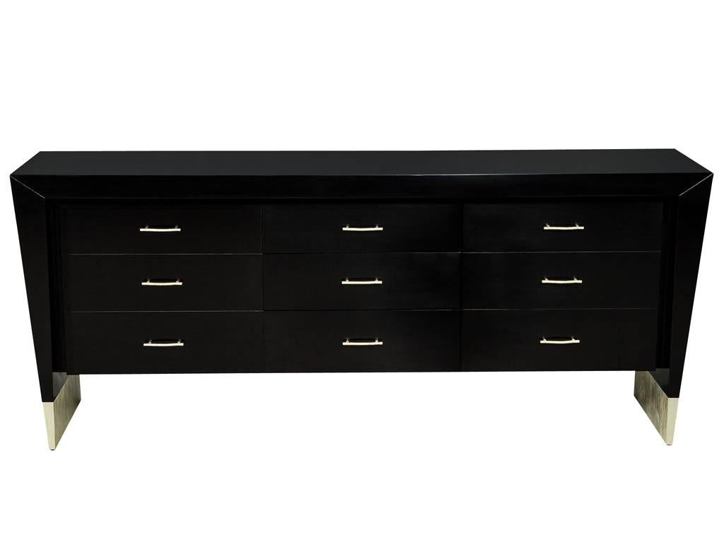 Modern black dresser buffet Baker Furniture Jacques Garcia Rachmaninov. Part of the Jacques Garcia Collection Baker Rachmaninov chest, hand polished walnut with silver leaf accents. Designed with a sleek angled design and custom matching knurled