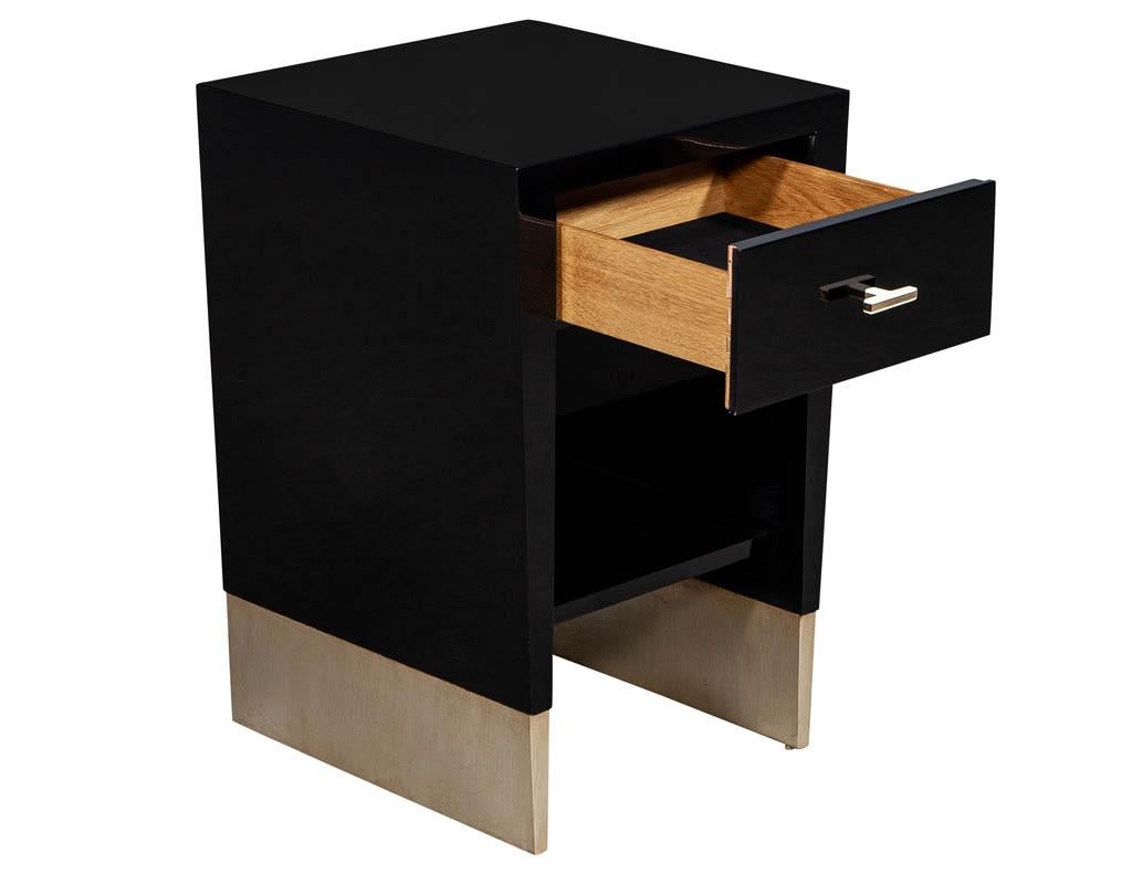 Modern black lacquer end table Rachmaninov by Jacques Garcia Baker. Sleek modern design in hand polished black. Featuring sleek hardware and metal leaf foot accent.

Price includes complimentary curb side delivery to the continental USA.

 