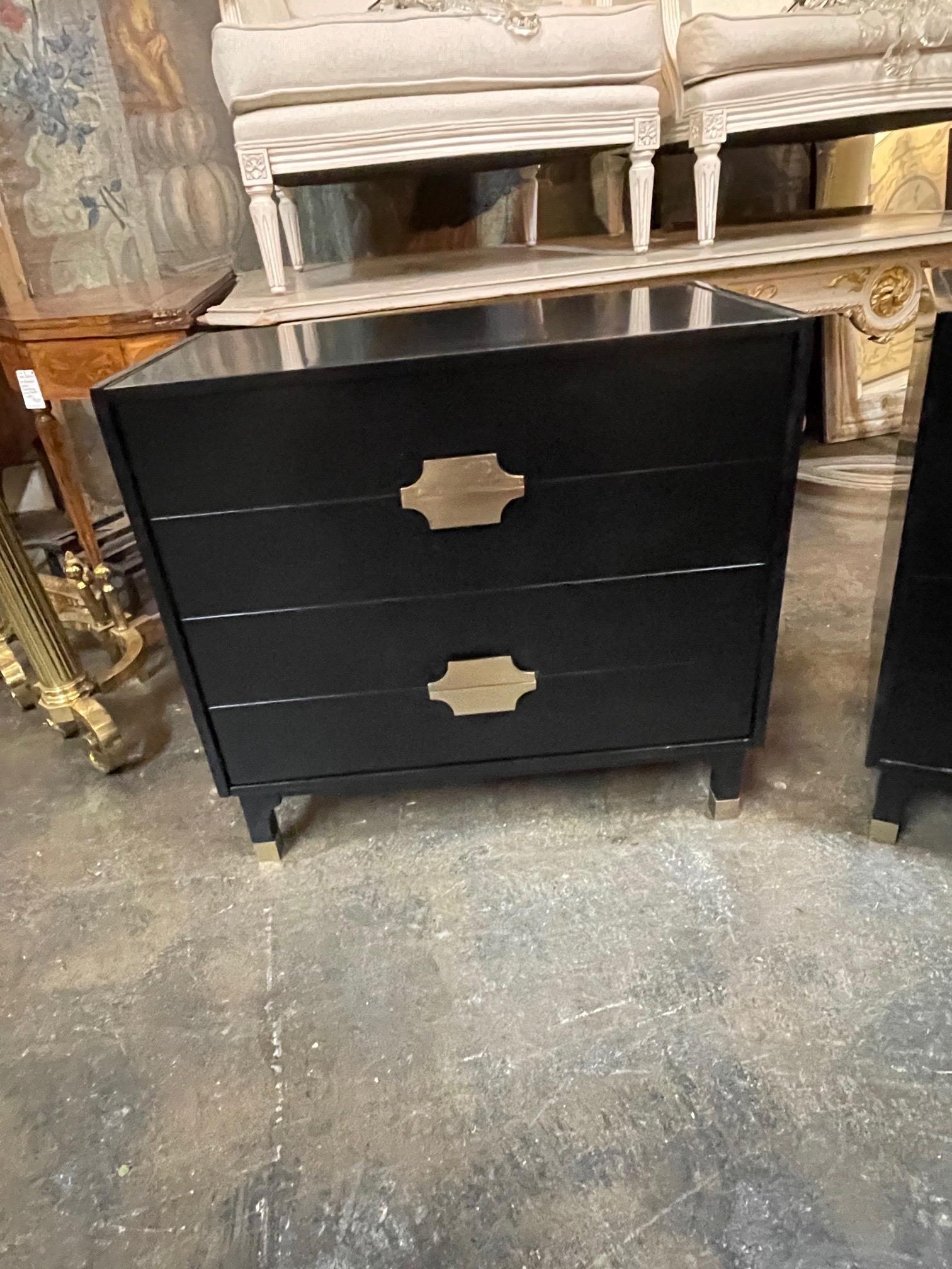 Very sleek looking modern black lacquered bedside tables from Italy. Nice brass hardware and brass details on the legs. Great for a variety of decors! Note: Price listed is per item.