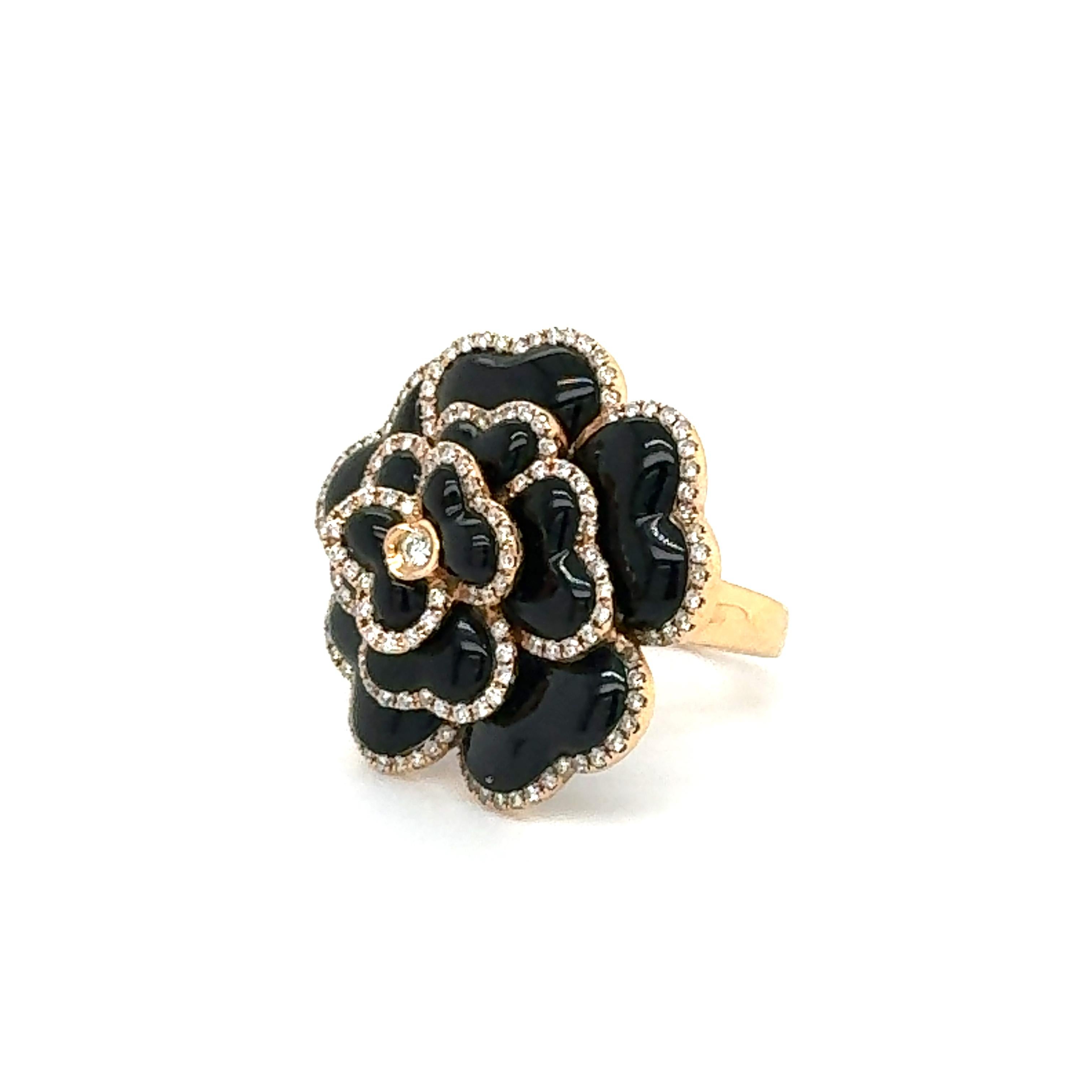 Beautiful ring crafted in 18k rose gold, the ring is crafted in the form of a blossoming rose flower. Set with onyx gemstones and round brilliant cut diamonds, this ring is eye catching and a true statement ring.
The black petals are hand carved