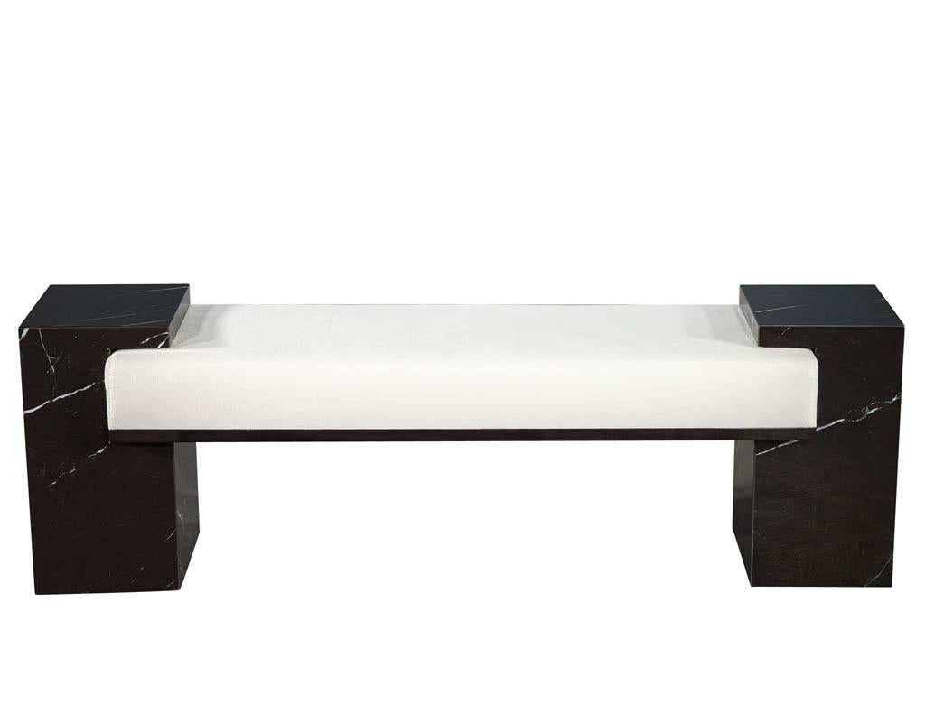 Modern black porcelain bench. Hand crafted using the finest materials imported from Italy. Beautiful Italian black porcelain columns with white veining. Completed with textured designer linen fabric and black lacquered trim detail. Porcelain veining