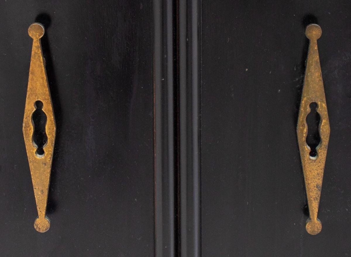 Black painted two-door cabinet. Measures: 28
