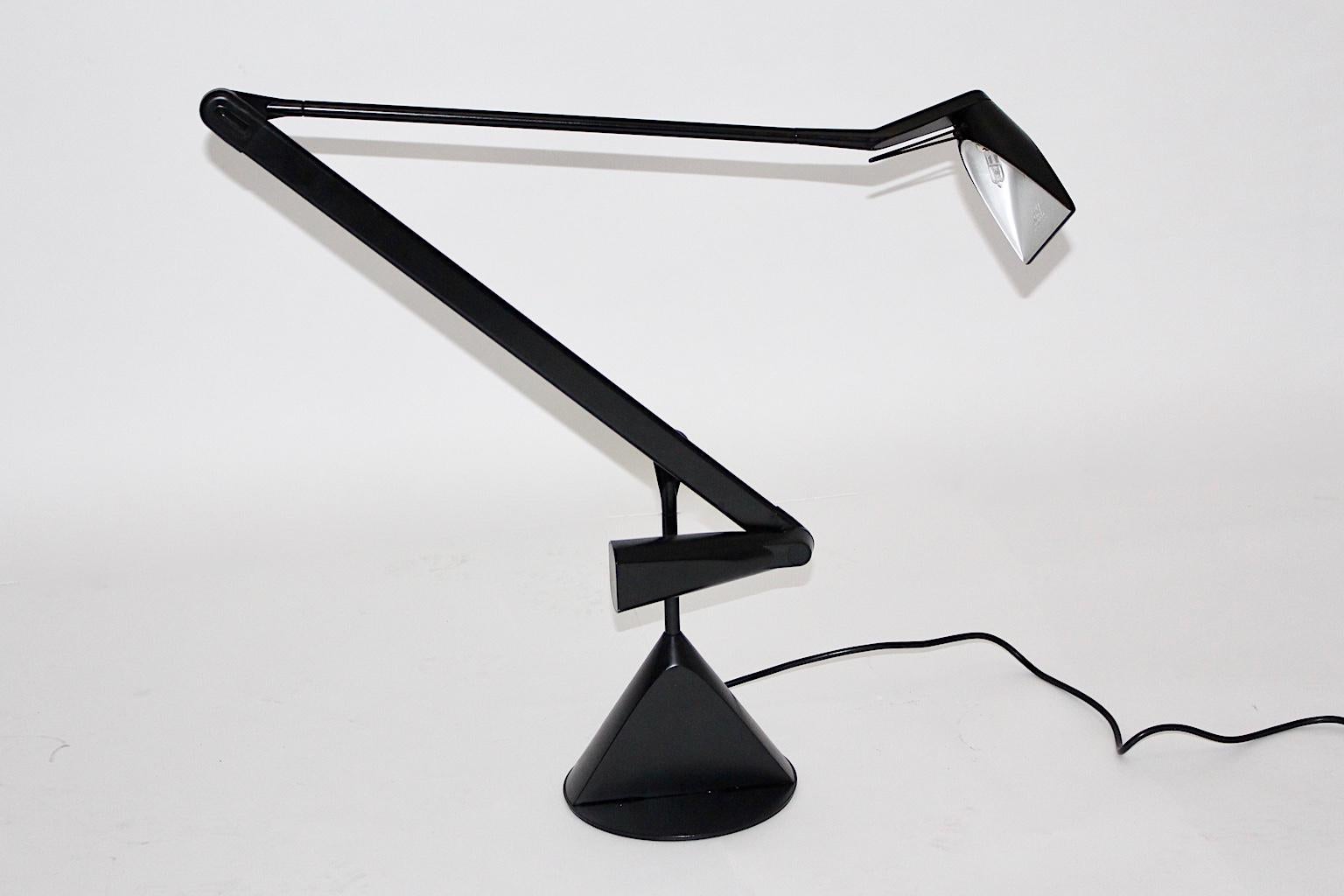 Modern vintage table lamp or desk lamp or architect lamp designed by Walter A. Monici for Lumina, Italy. Marked
A triangular shaped base with a folding and fold out arm points out the design features from the 1980s, when geometric forms are very