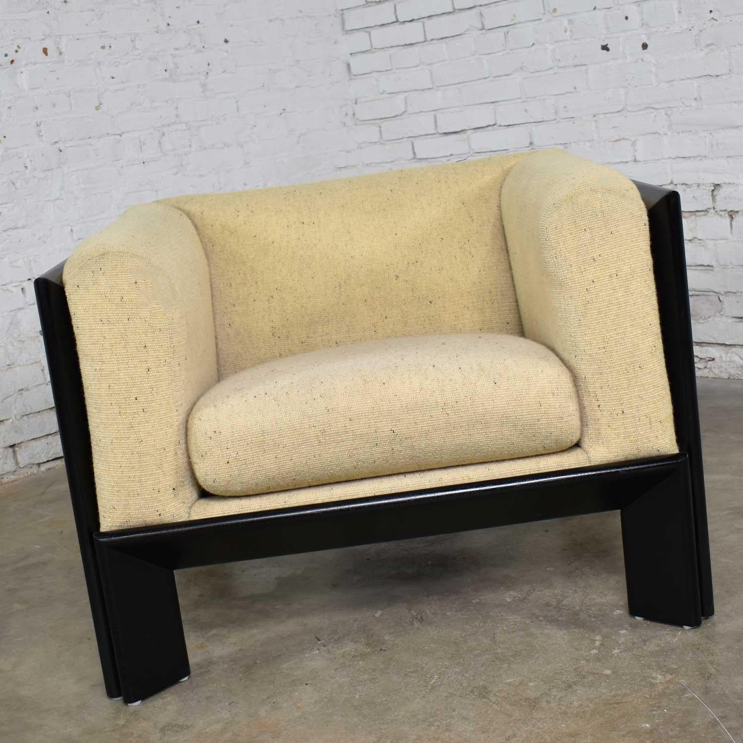 Handsome cube shaped club or lounge chair in black and white by Metropolitan Furniture Co. of San Francisco and made exclusively for Marshall Fields. This chair is in fabulous condition. The original oatmeal white upholstery has been professionally