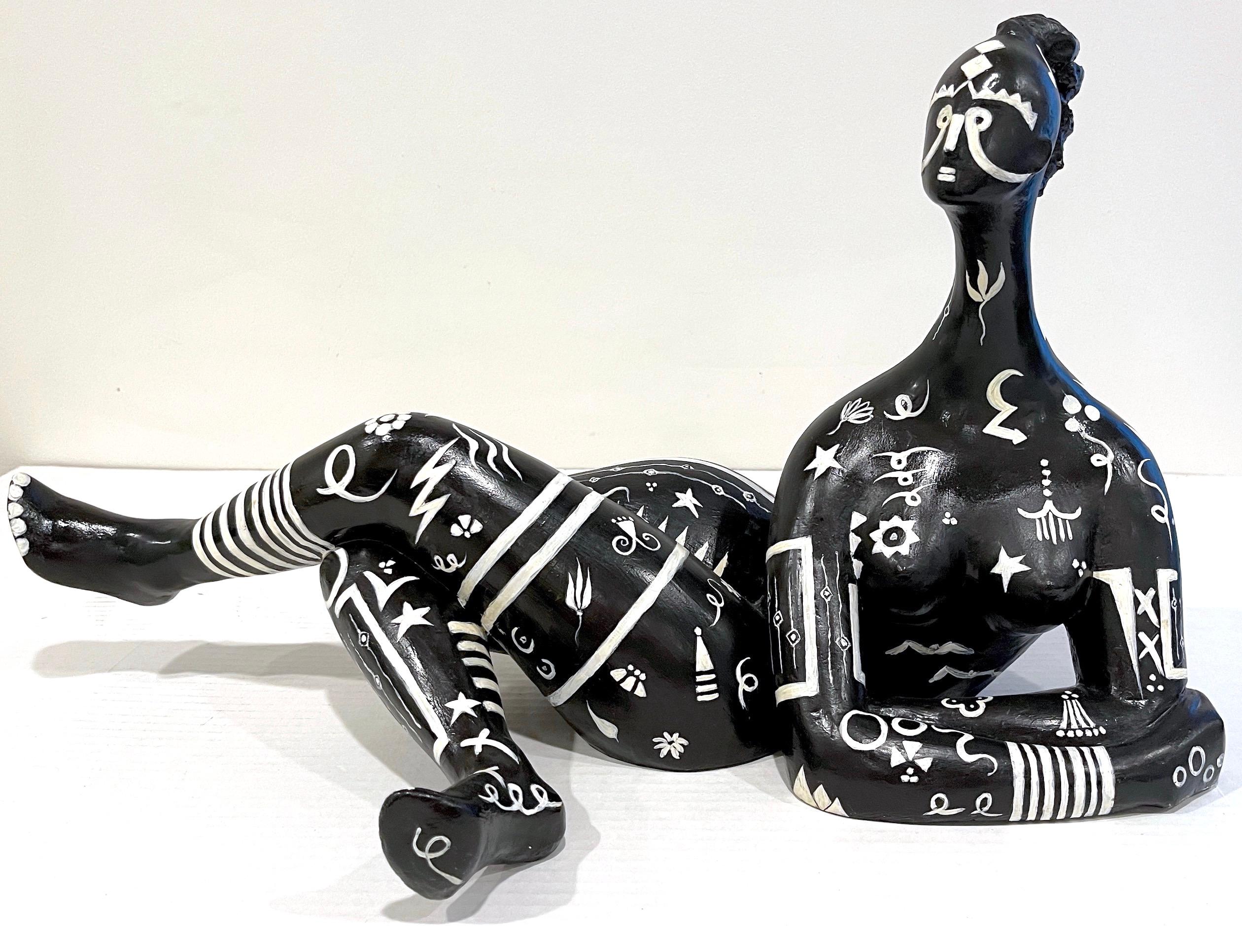 Modern black & white sculpture of a reclining tribal tattooed African Queen
Purchased in France, in the 1960s
Unsigned

A heavy, impressive, substantial three dimensional work. The sculpted plaster nude female figure, finely modeled with and