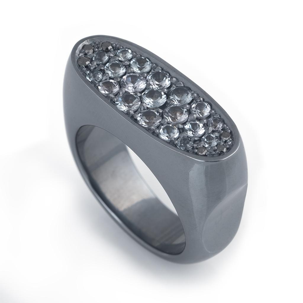 Gray spinels and black diamonds have been set into blackened sterling silver ring.
The gray gemstones sparkle in this moody ring. The ring features a Biomorphic design to fit comfortably on your finger. 
This ring is bold and striking. A unique