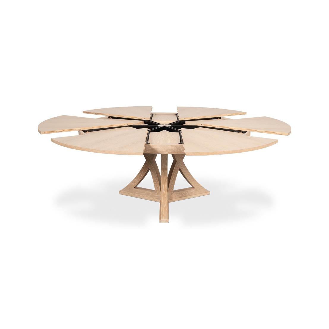 Crafted from oak in a light natural bleached oak finish, the table features a striking radial-patterned top and a unique, geometric base that blends elegance with contemporary style. 

With a re-engineered extension mechanism, crafted from durable