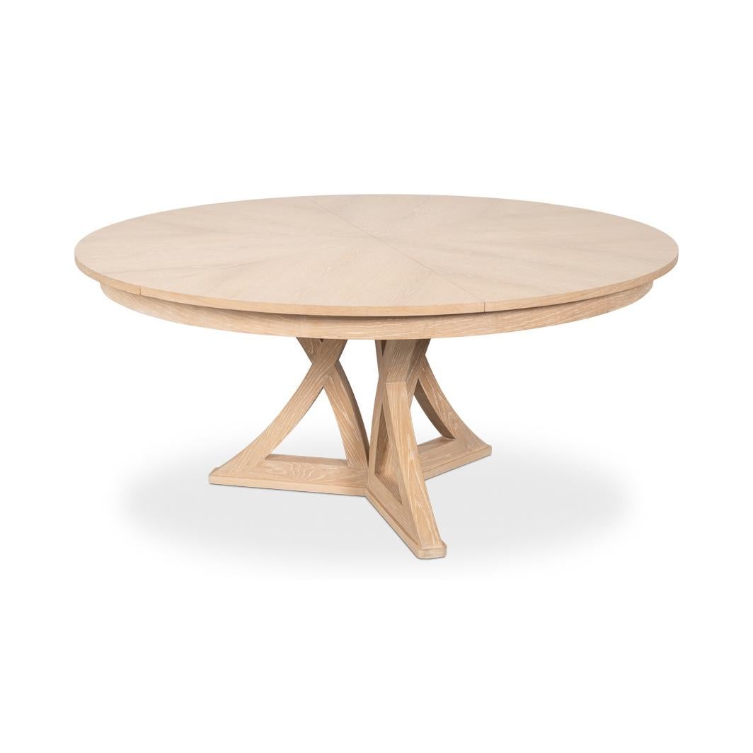 Crafted from oak in a light bleached oak finish, the table features a striking radial-patterned top and a unique, geometric base that blends elegance with contemporary style. 

With a re-engineered extension mechanism, crafted from durable extruded