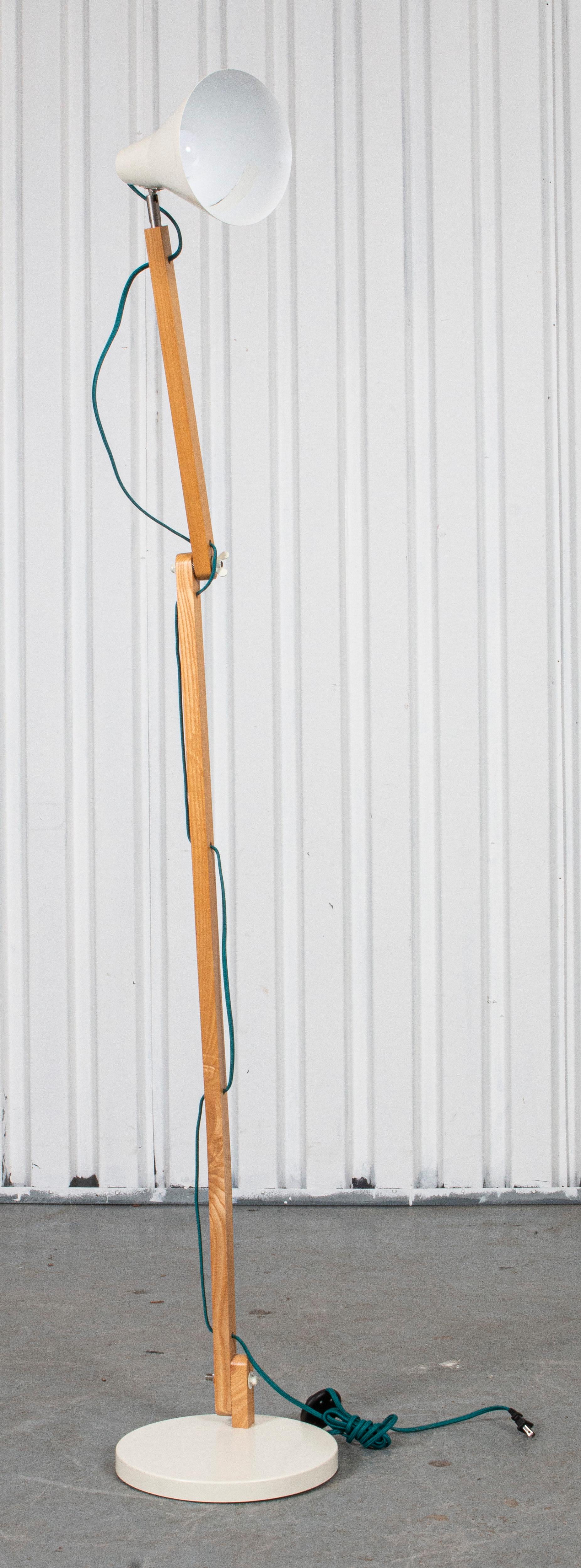 Modern blonde wood and enameled metal floor lamp. 
Measures: 72” height x 18” diameter.