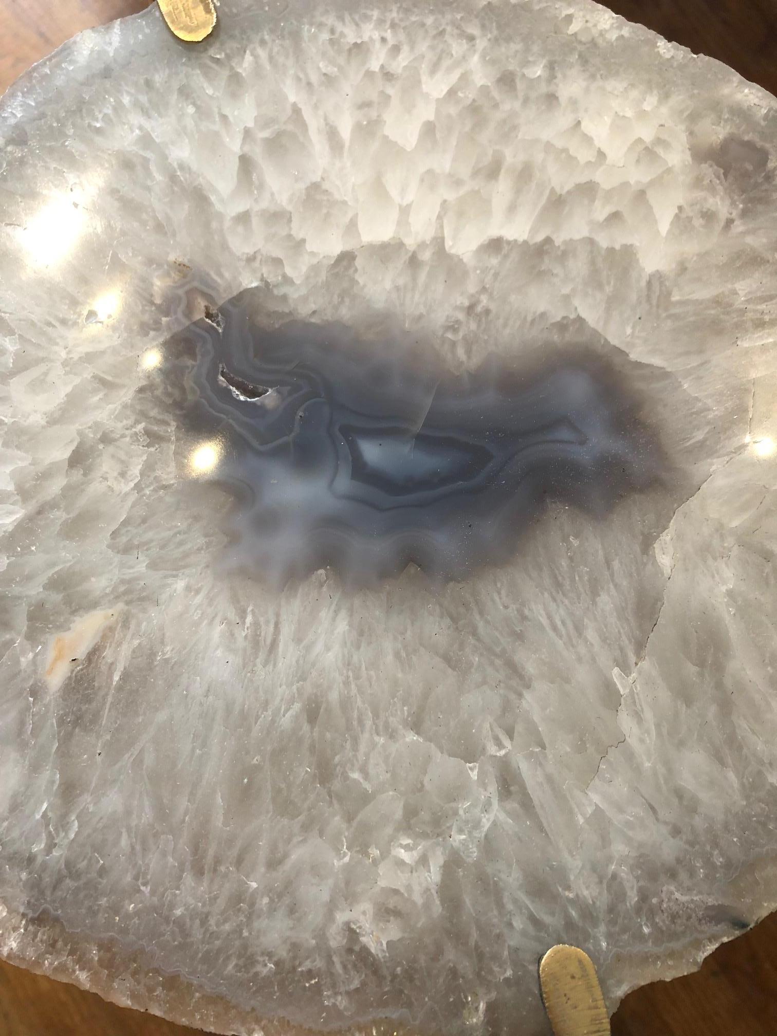 Unusual modern handcrafted drinks table. Large Quartzite Geode top with gilded steel base.