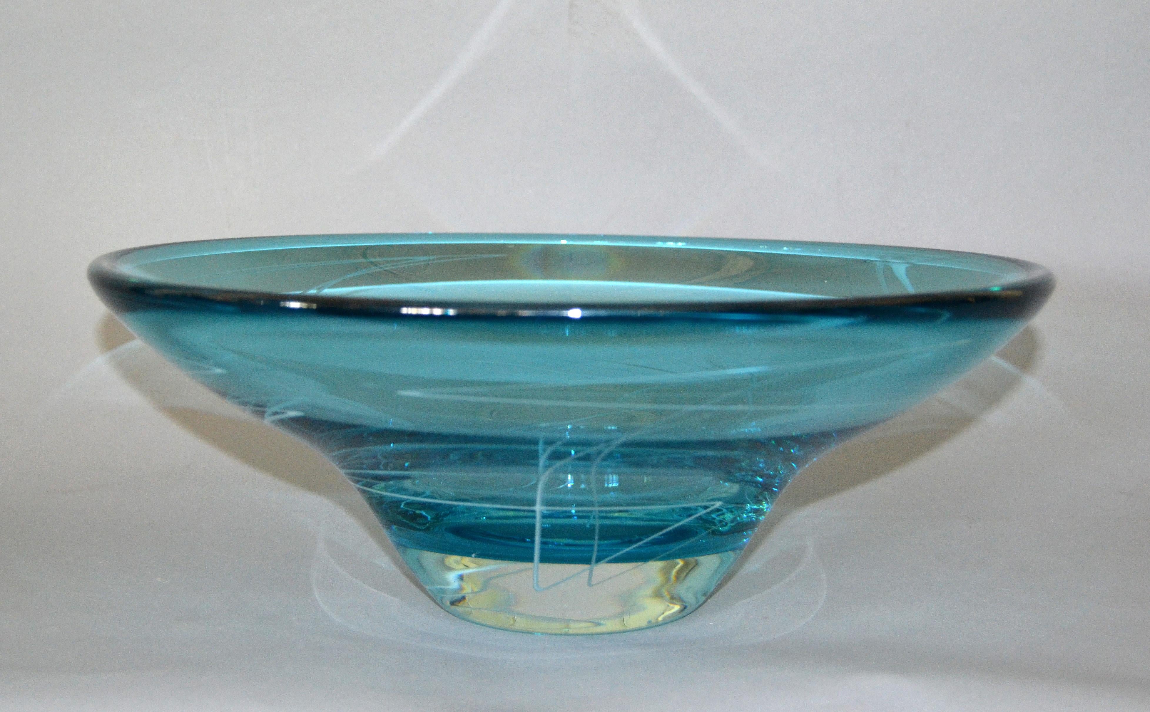 A stunning contemporary art glass centerpiece or fruit bowl by Mark J. Sudduth.
Rich blue coloring at the top fades to clear at the bottom.
Floating geometric lines are layered in the bowl.
Signed Mark J. Sudduth.
