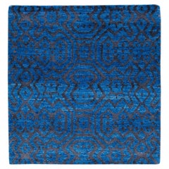 Moderner blauer handgefertigter geometrischer Wollteppich