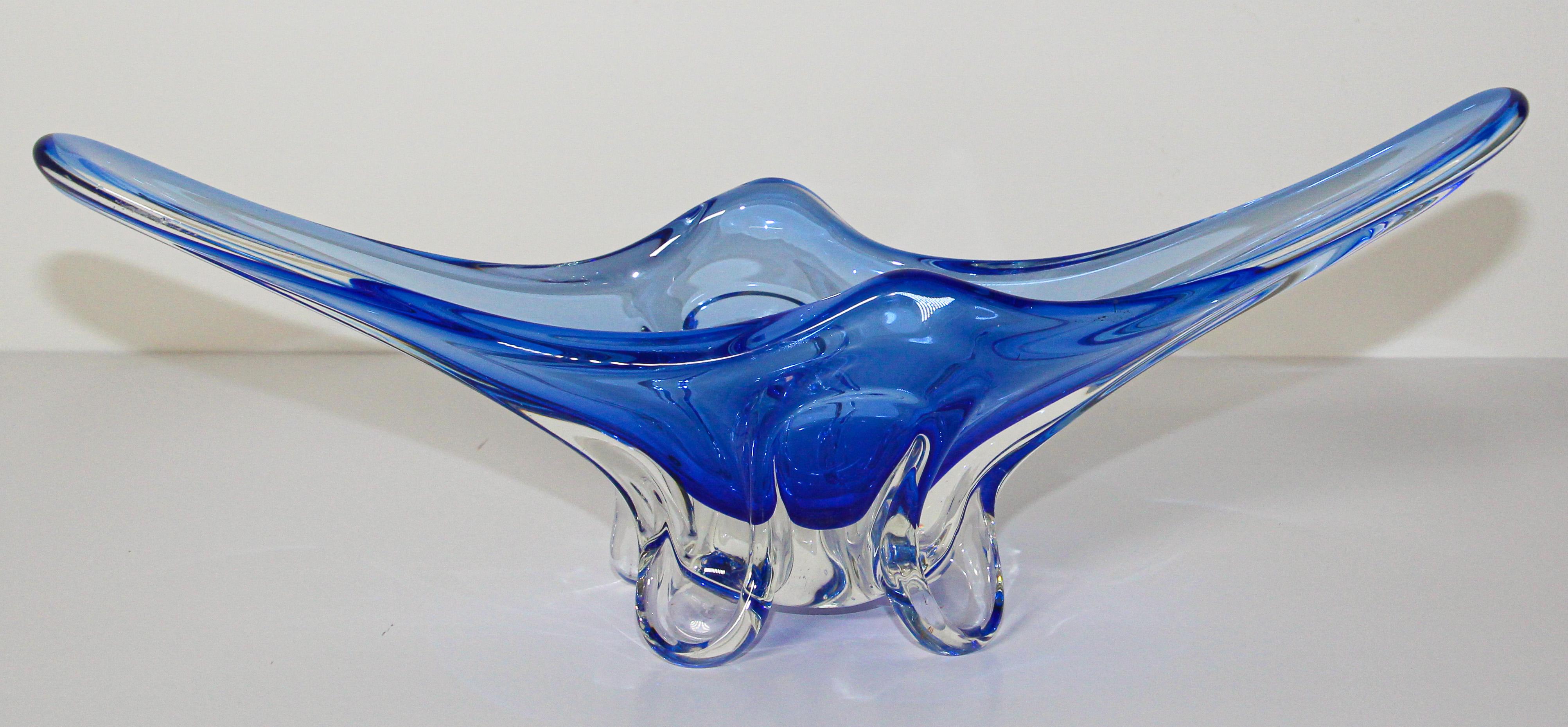 Large exquisite modern decorative hand blown Murano art glass bowl with a radiating stylized design in an amazing royal blue glass.
Beautiful Murano midcentury hand blown decorative bowl in a thick elongated shape handcrafted in Italy, circa