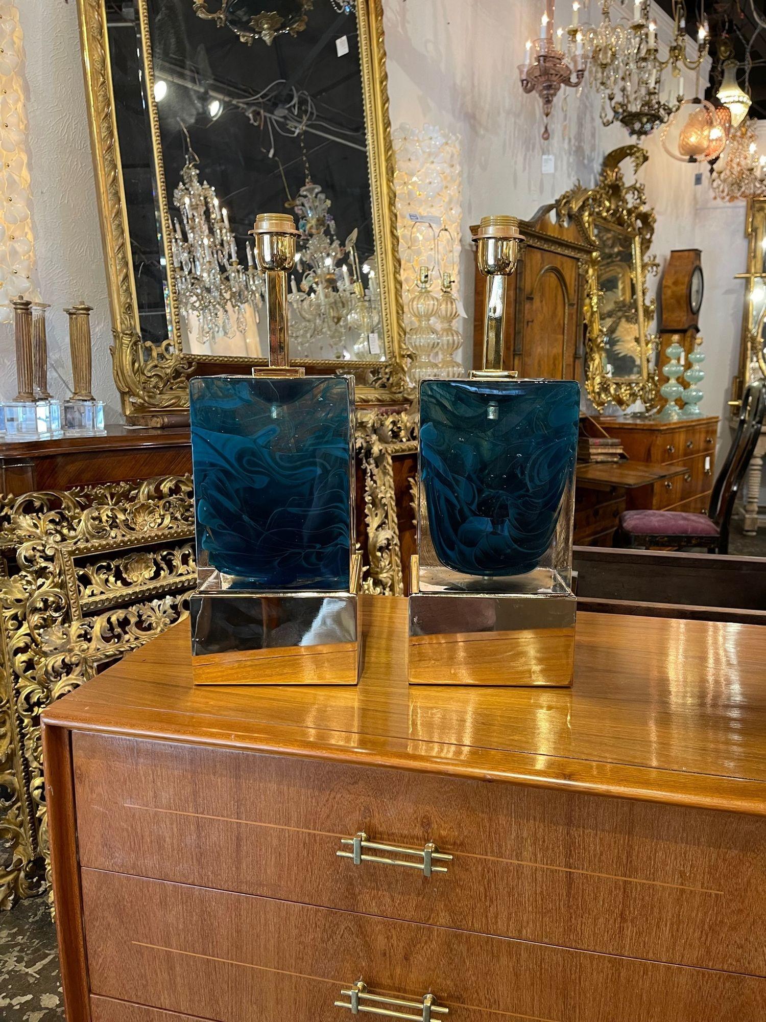 Gorgeous pair of modern blue Murano glass block lamps on a polished brass base. Featuring a vibrant color on the glass and a decorative brass base. These are exceptional!!