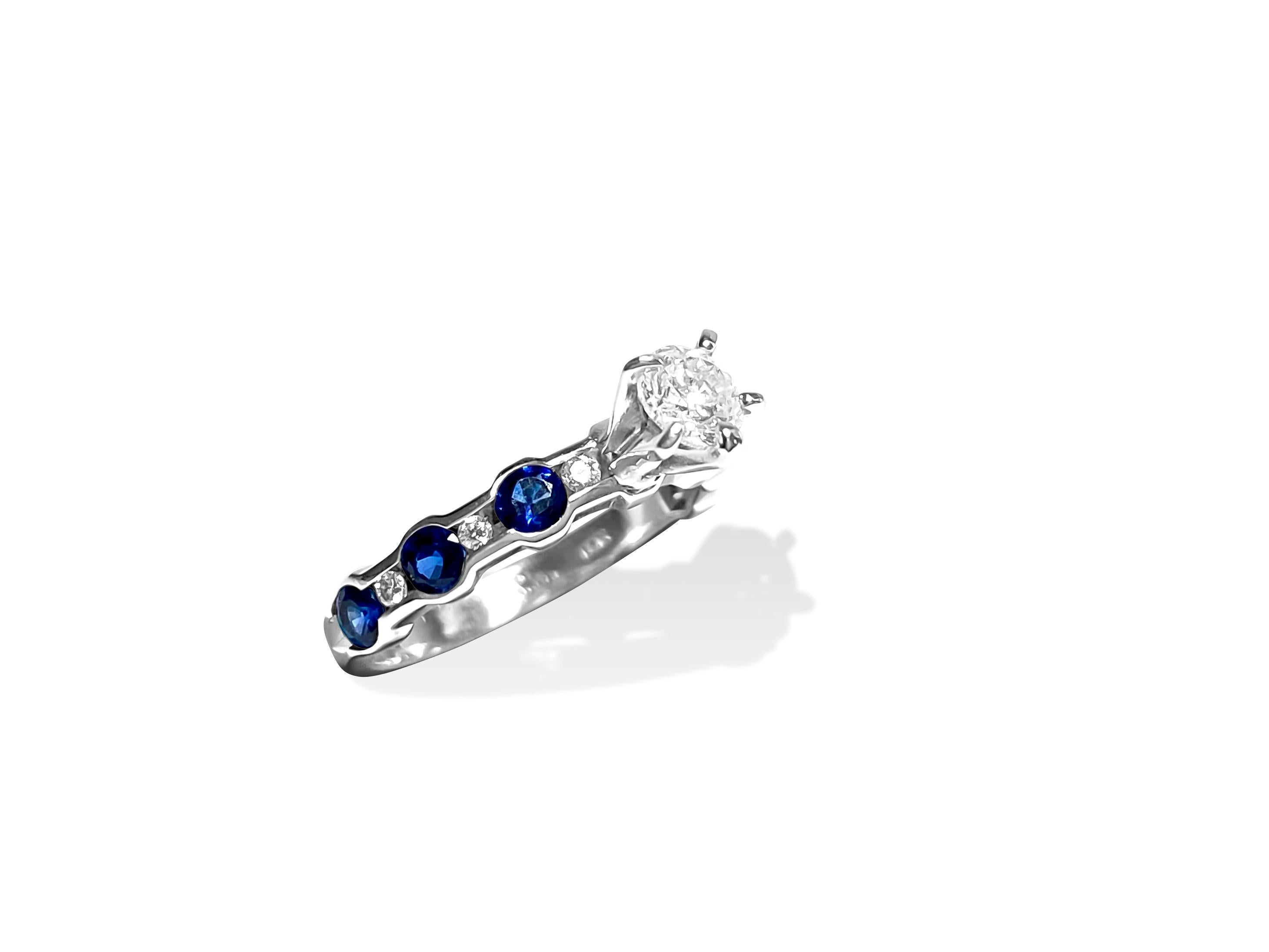 Metal: 14k solid white gold.

 Round cut sapphires, total number of sapphires: 6. Set in prongs. 

Total number of diamonds: 7. F-G color and VS clarity. 

Diamonds shape: round brilliant cut. Channel setting 

All gemstones are 100% natural earth