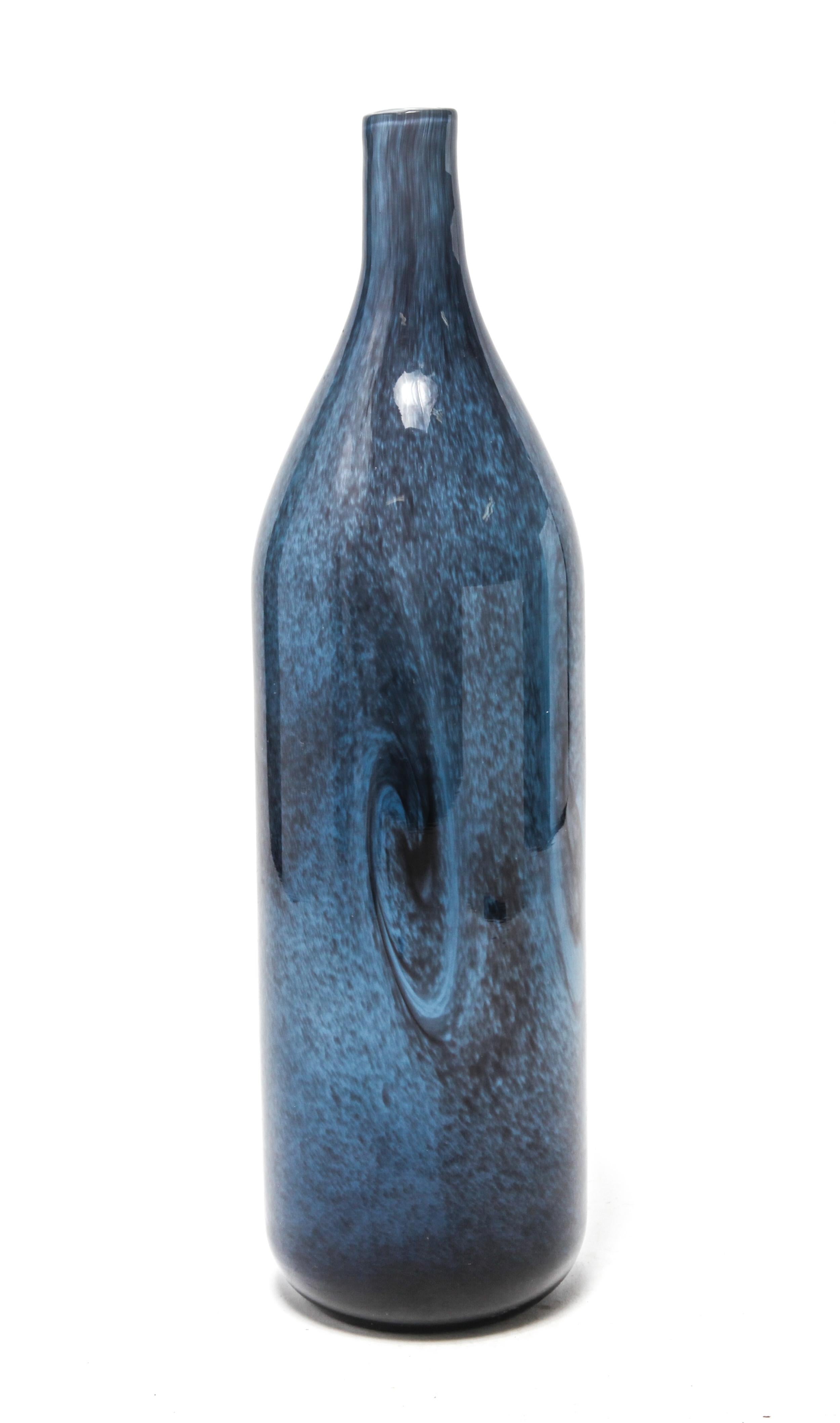 Modern studio art glass vase in bottle-form. The piece has blue & black swirls in a cased glass with a white interior. In great vintage condition with minor age-appropriate wear and use.