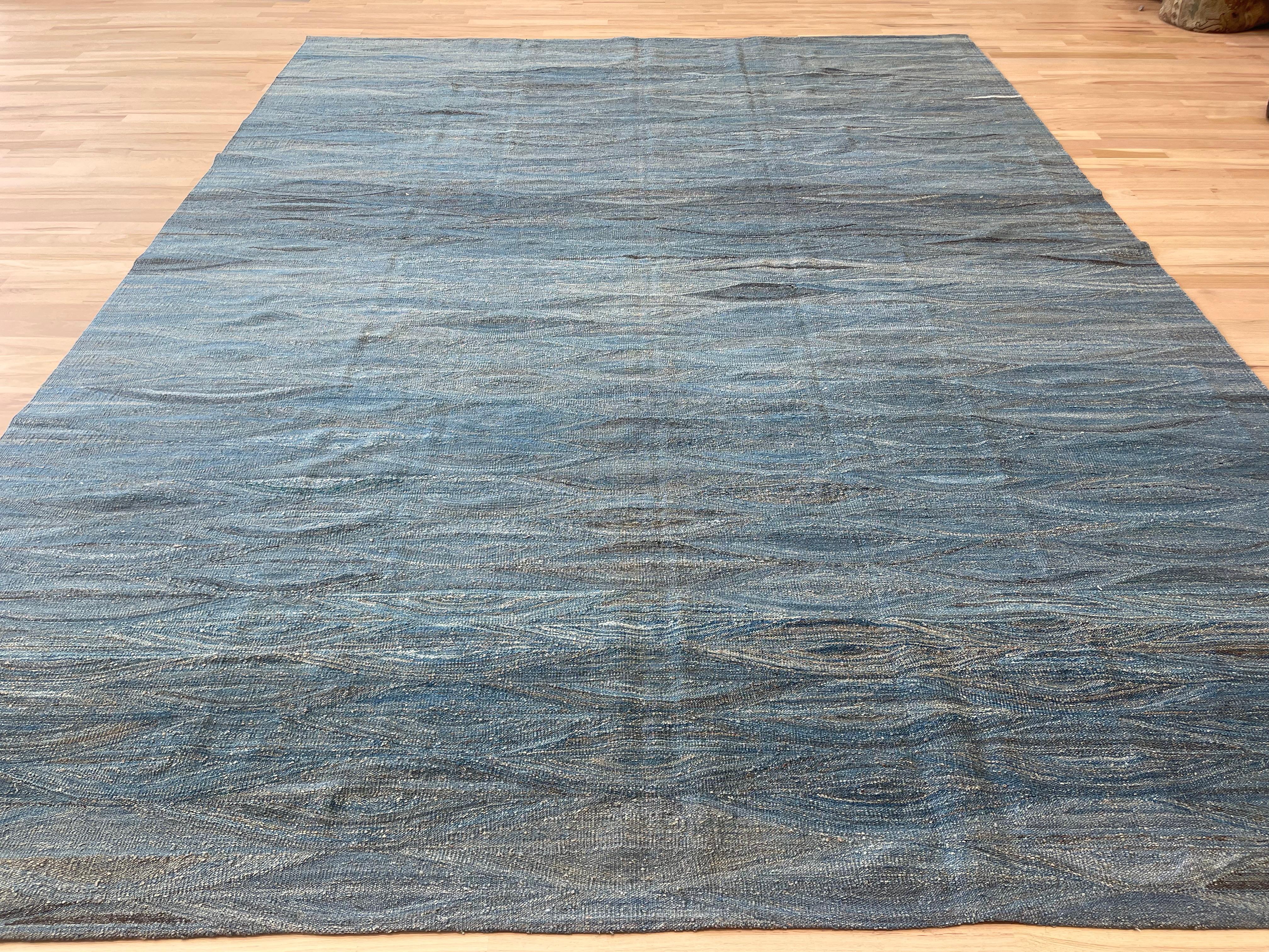 Elevate your home decor with our Turkish rug, featuring a stunning  shades of blue. With its reversible use, this rug offers versatility and a touch of elegance to any room. Add a pop of color and texture with our high-quality, handcrafted rug.