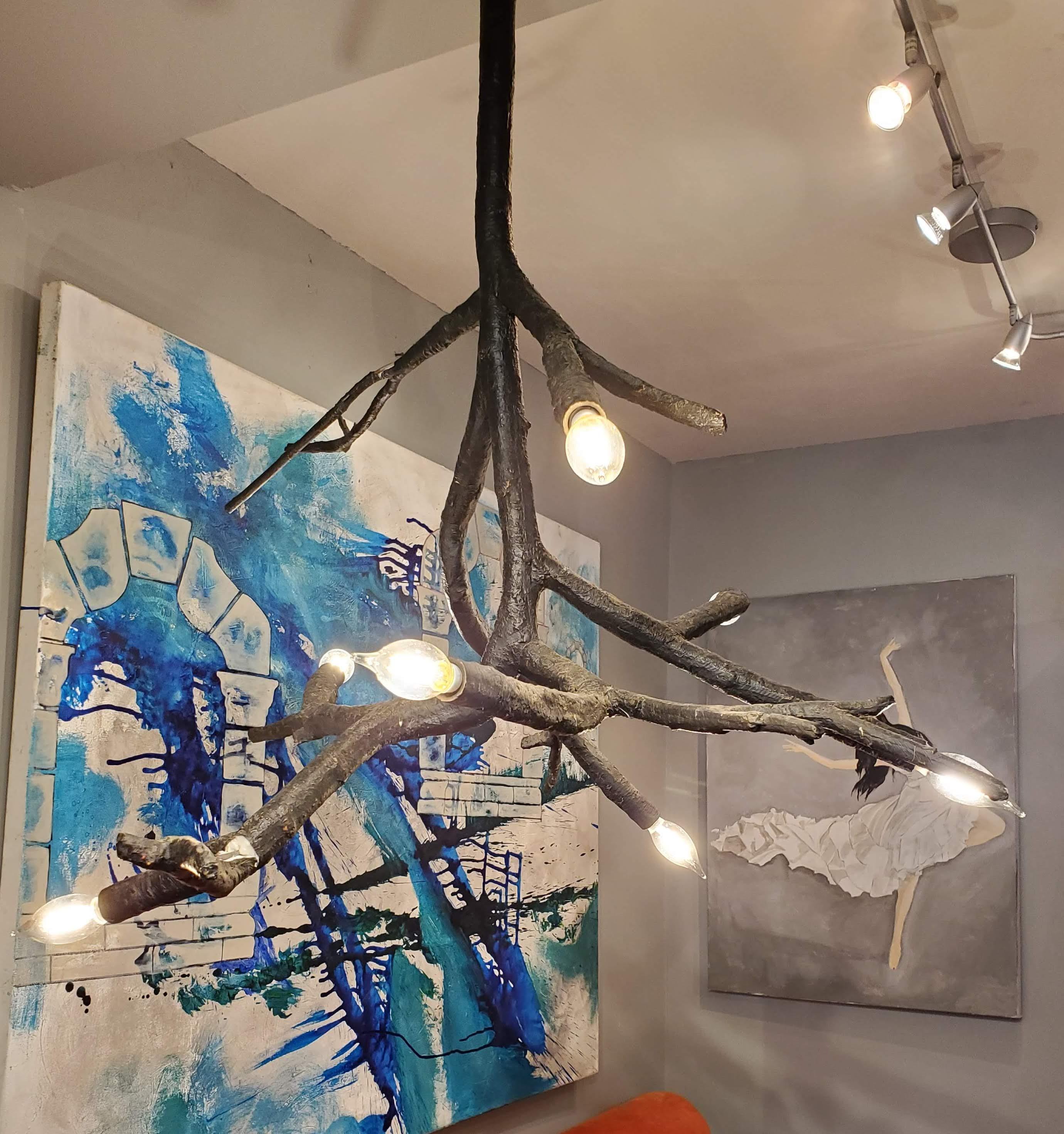 This modern metal freeform branch chandelier will get so many compliments from your guests. The seven-light made in the form of tree branches are so realistic that you will be second guessing whether or not it is real wood. Standard two prong plug
