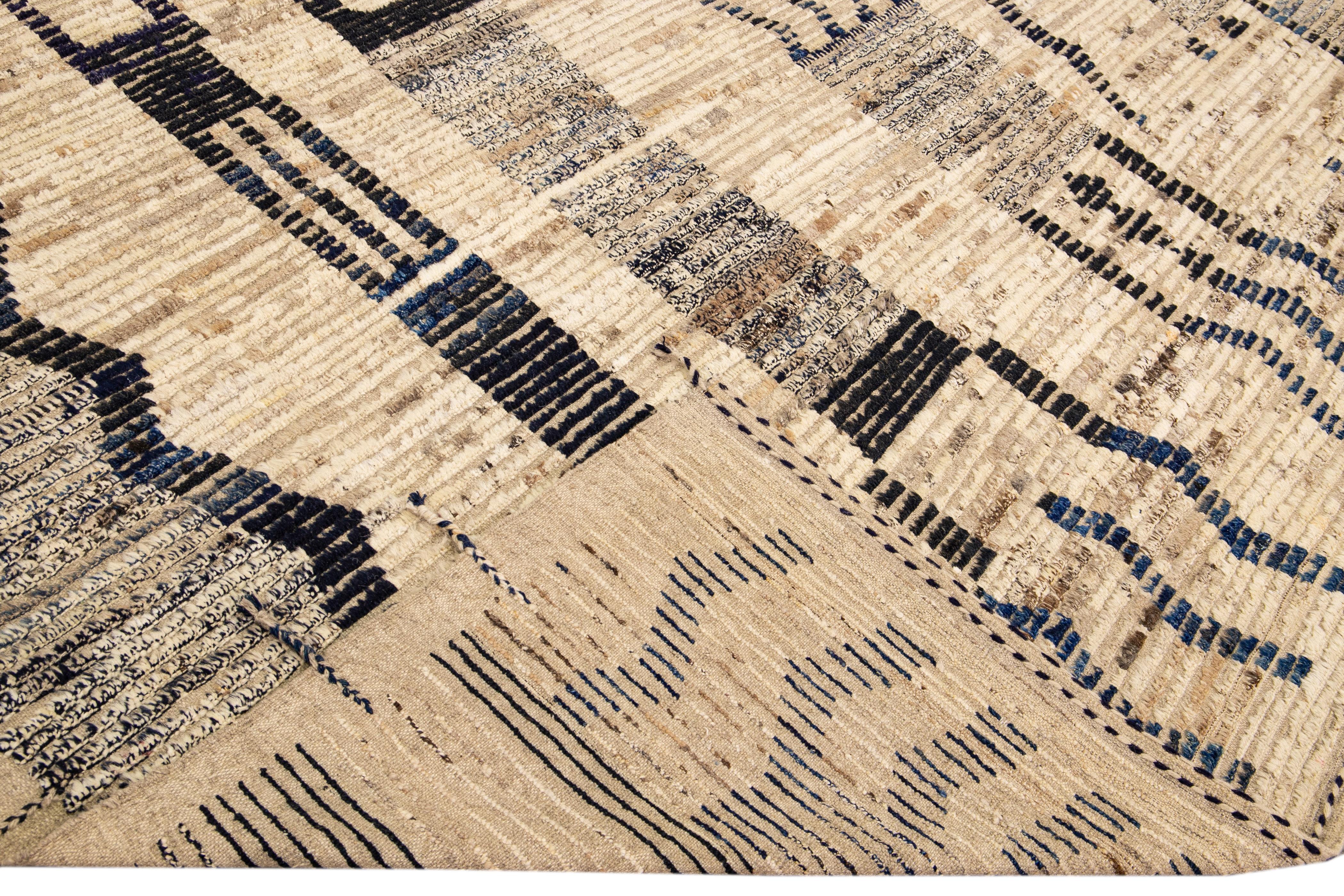 Beautiful Moroccan style handmade wool rug with a beige and brown field. This Modern rug has black and brown accents and beige-black braid fringes featuring a gorgeous all-over geometric boho design.

This rug measures: 12'4