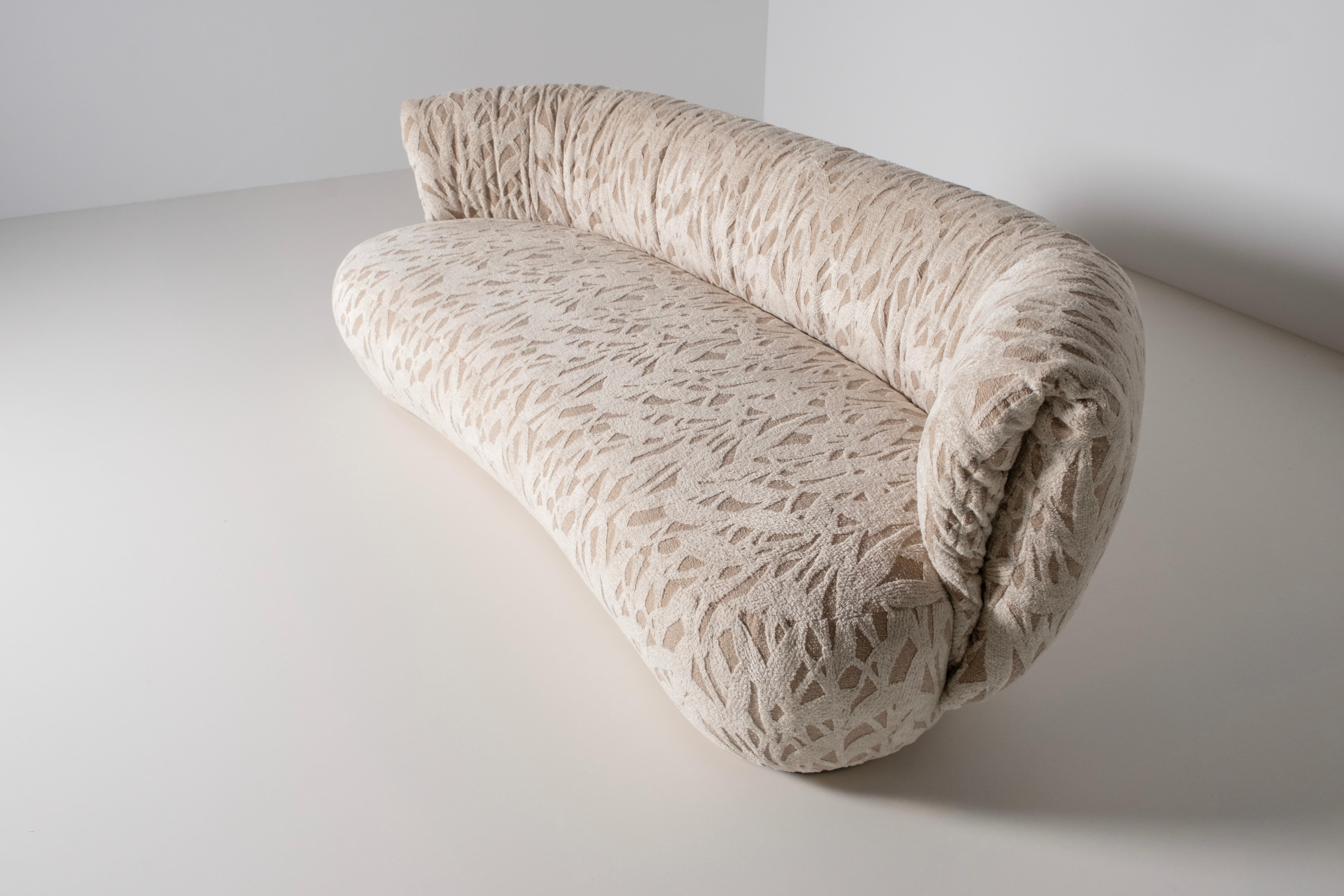 Bolota Sofa, Contemporary Collection, Handcrafted in Portugal - Europe by Greenapple.

The Bolota curved sofa captures the organic beauty of nature, taking inspiration from a dewdrop resting delicately on a blade of grass. Its artistic form and