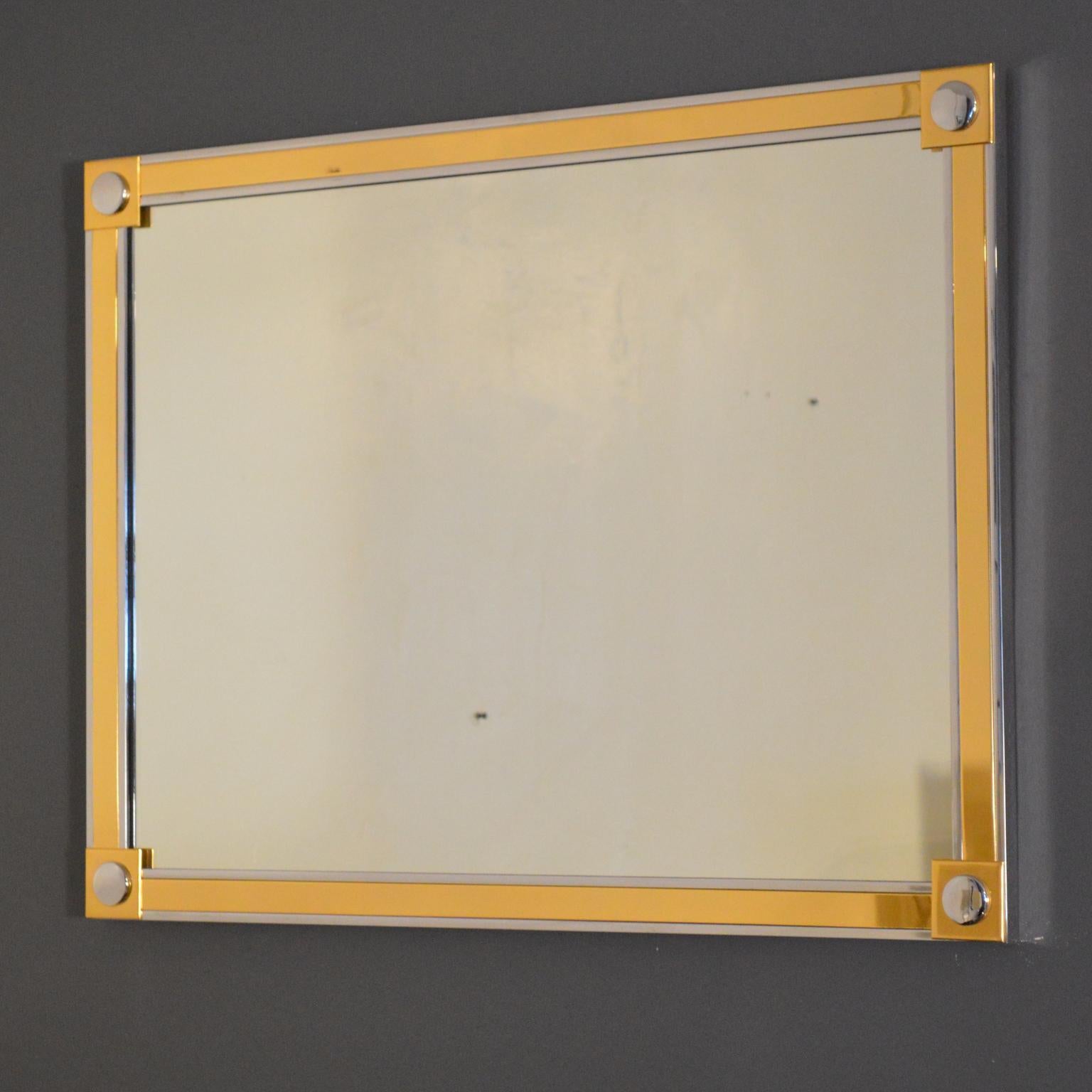 High quality mirror, clear, heavy, flaw-free, in steel frame plated with brass and chrome. Heavy-duty mounting hardware and symmetric design permit hanging in vertical and horizontal orientations. Similar in aesthetic and construction to Romeo Rega