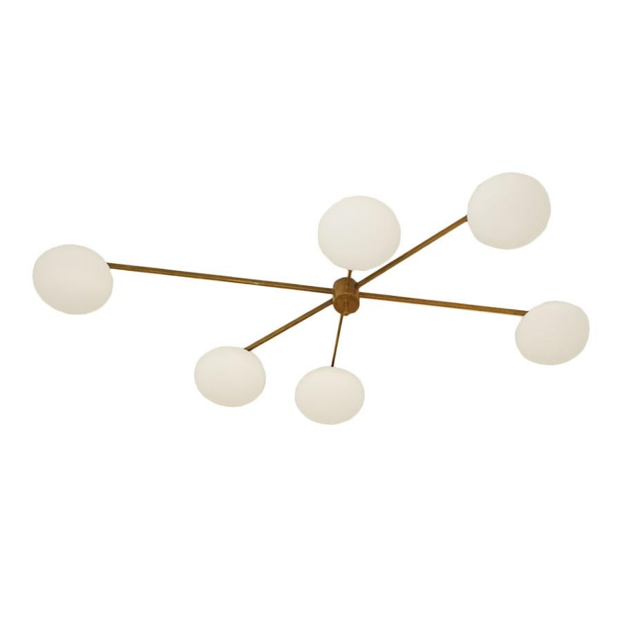 Ceiling lamp flush mounted composed of six glass sphere with one bulb each. Structure made in brass. Made in Italy.
 
Italian designer-entrepreneur Angelo Lelli—also spelled “Lelii,” as indicated by in a surviving signature—founded the innovative