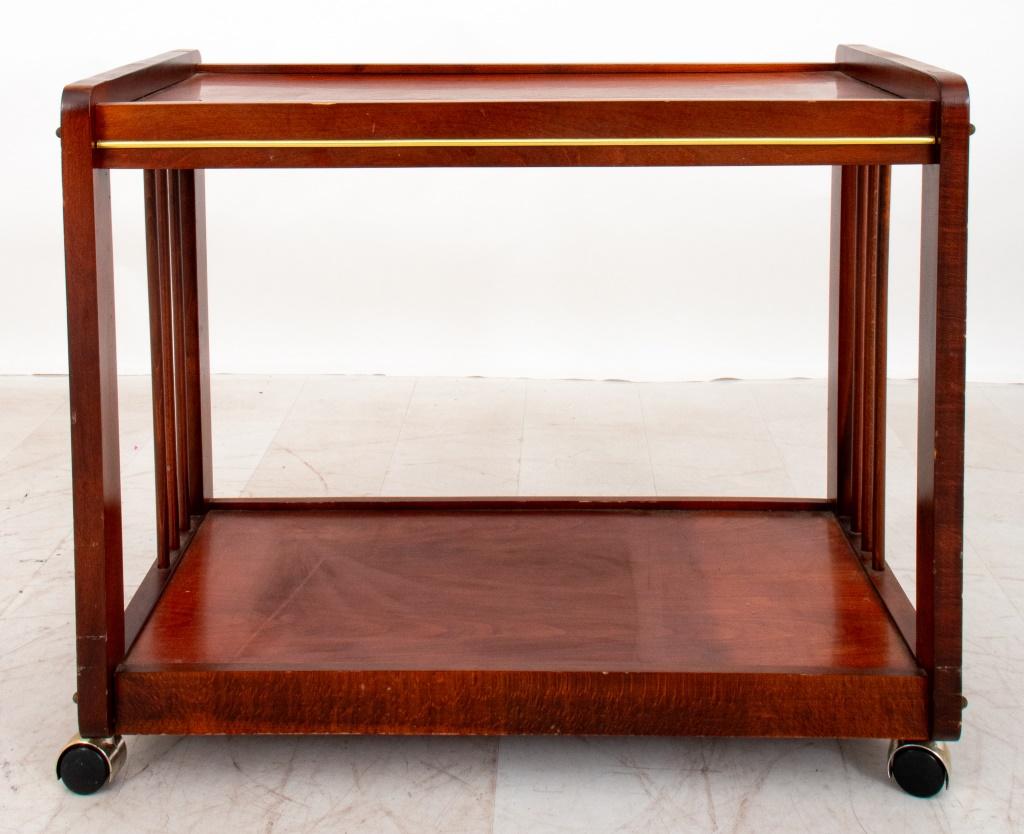 Modern Brass and mahogany rolling table, likely for TV or study, rectangular and with strung sides, on brass casters.

Dealer: S138XX