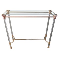 console moderna in ottone e vetro plexi con piano in vetro
