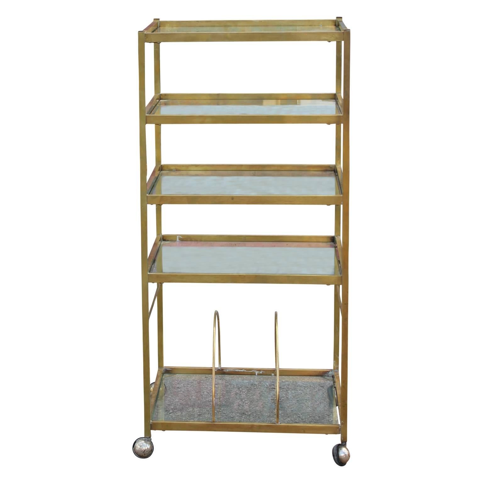 Modern brass bar cart or display with glass shelves. Made in Argentina in the 1960s in the style of Maison Jansen.