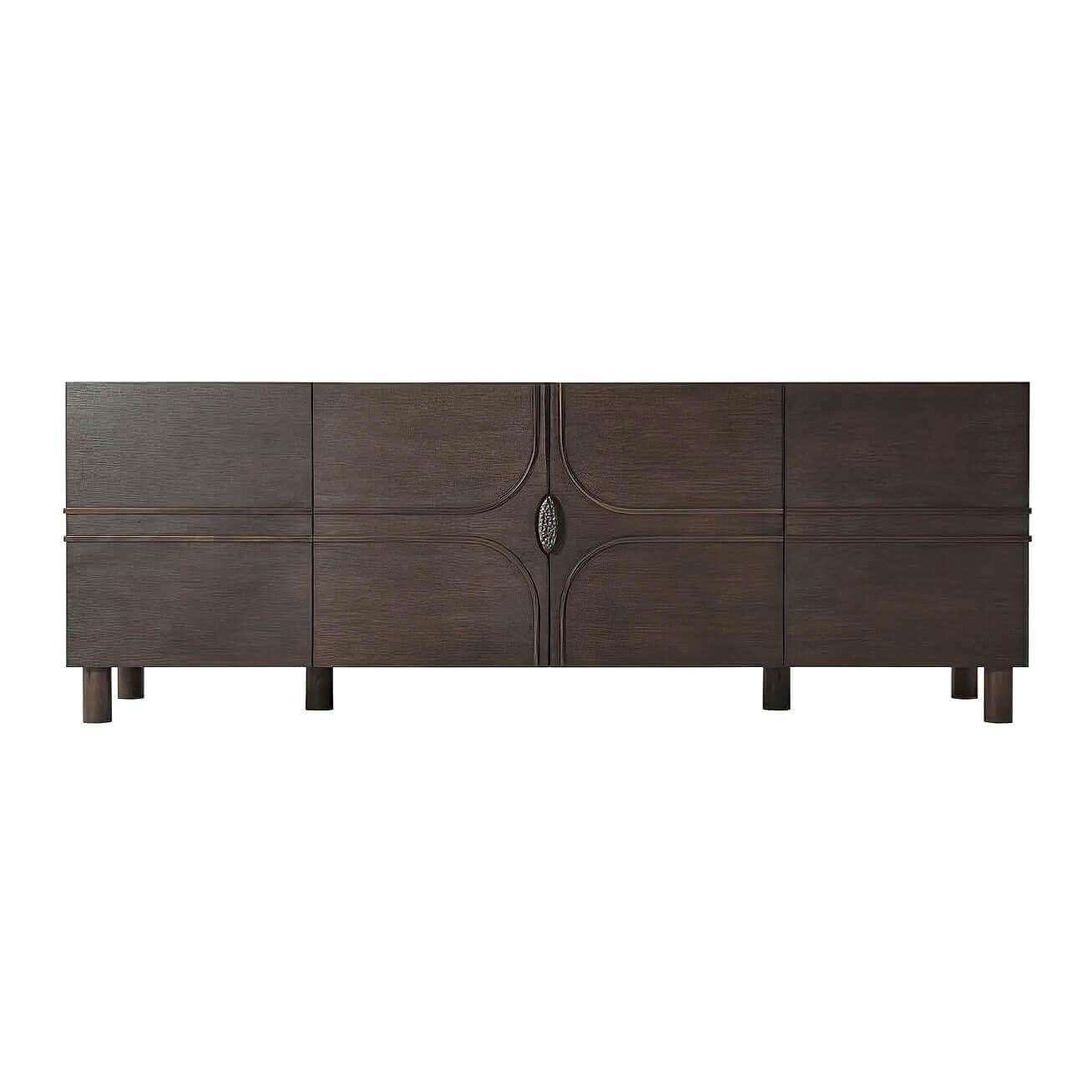 Modern oak veneered four-door brass bound sideboard buffet cabinet with bronze chiseled organic handle and raised on turned oak cylinder legs. The interior three sections with adjustable shelves.
Dimensions: 84