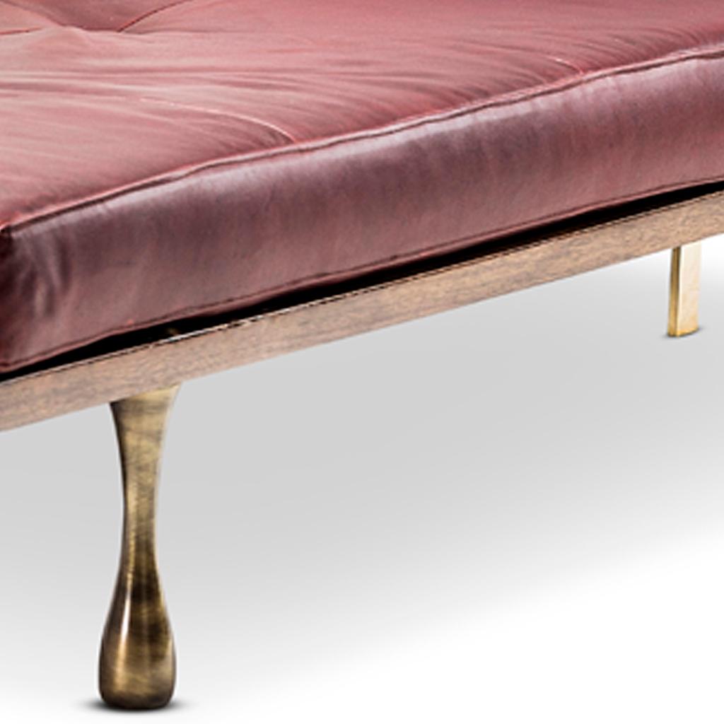 This daybed, chaise lounge is part of the Little Miss Fat collection designed by Egg Designs and manufactured in South Africa.
The daybed has a walnut timber base with leather cushion accented with solid brass back legs and back support. The front