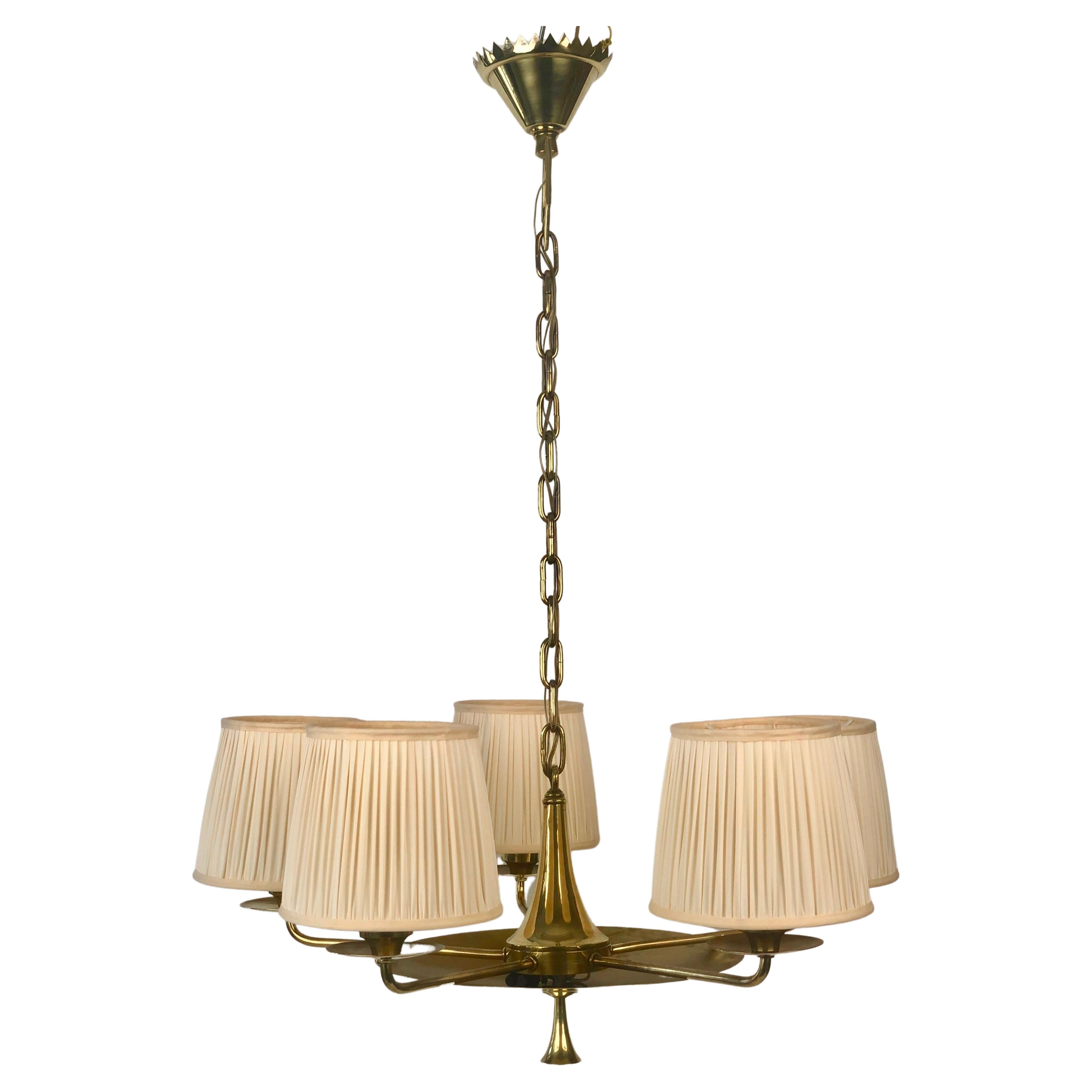 A beautiful five arm chandelier in brass from the 1920's. 

Designed and manufactured in Austria, as usual the quality is very high with wonderful craftsmanship. Please take time to look at the photos. You will discover an unusual canopy with a