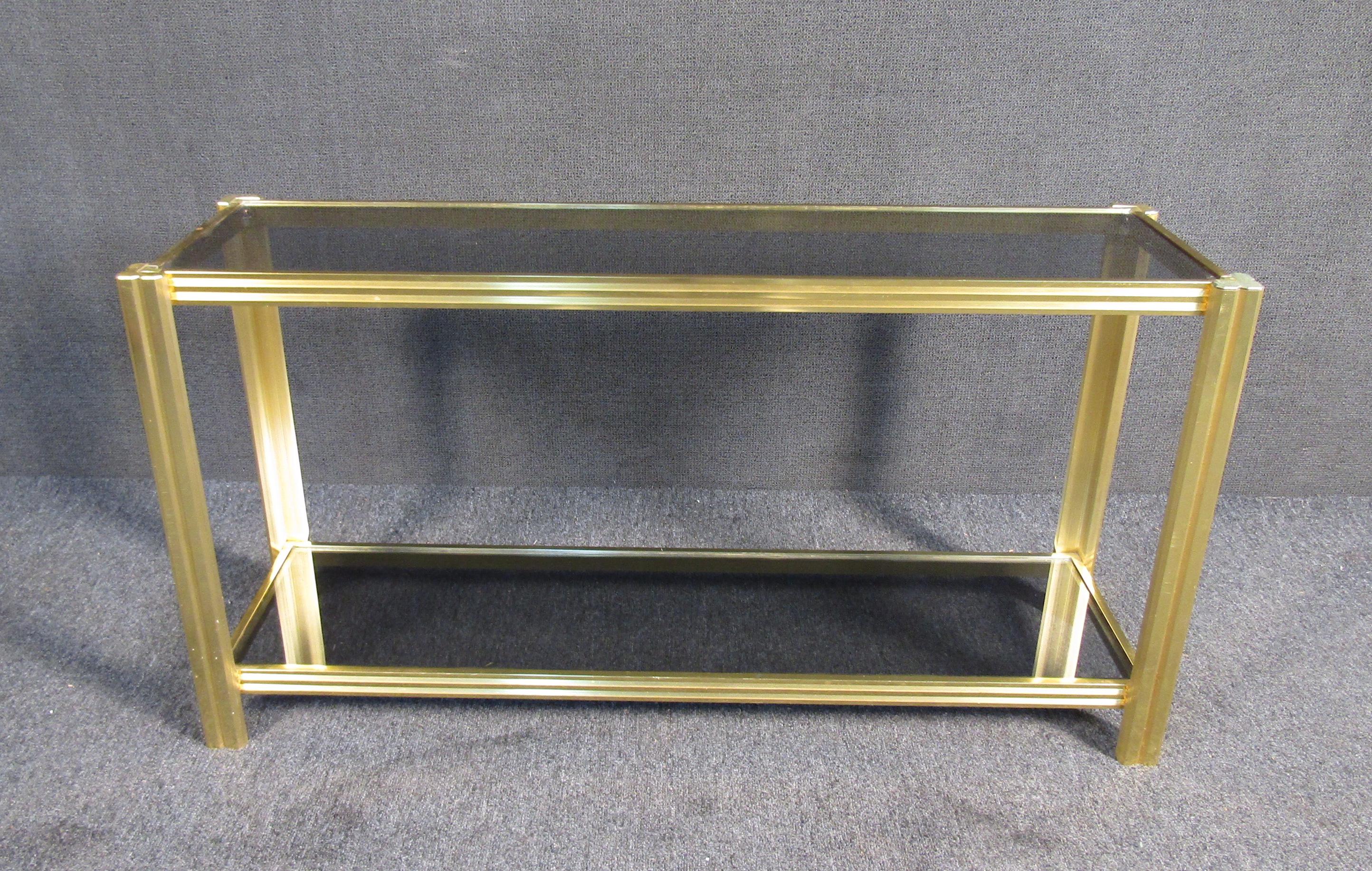 Vintage modern style two tier console table featuring smoked glass.

Please confirm item location (NJ or NY).