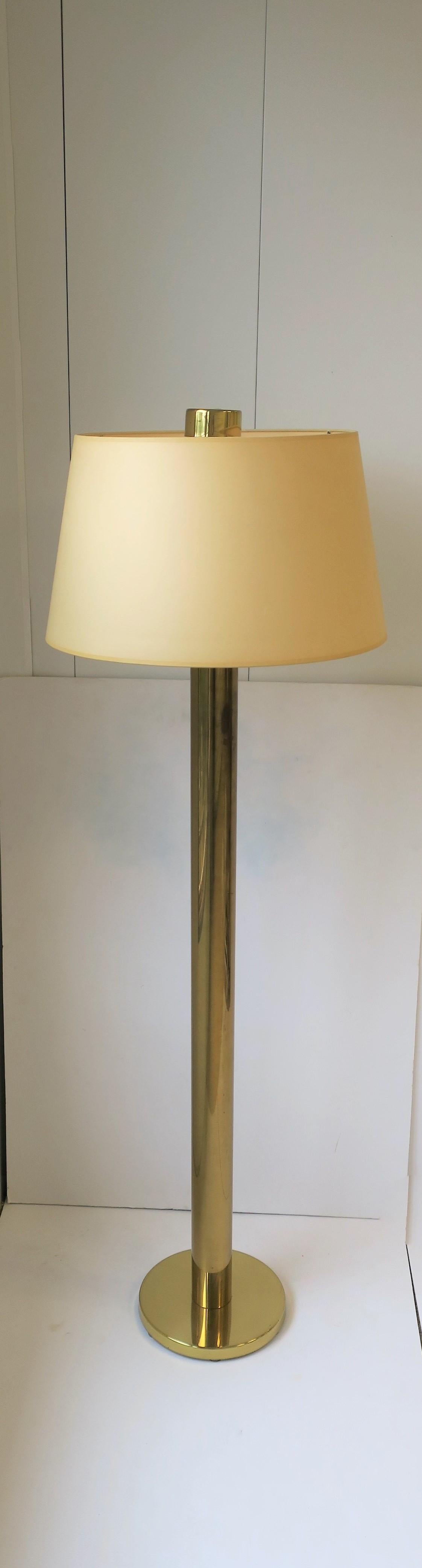 A 1970s modern brass floor lamp by Koch and Lowey. Floor lamp has tubular neck (2.75
