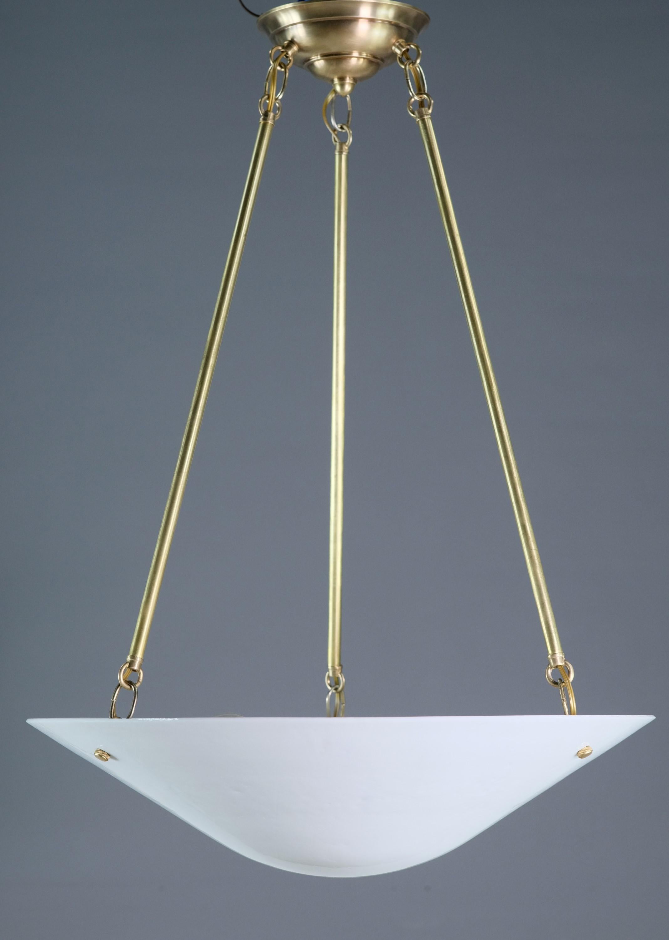 Restored and rewired Modern style pendant light with brass hardware and ceiling canopy. White glass dish light shade. Takes three E26 Edison standard household light bulbs. Small quantity available at time of posting. Priced each. Please inquire.