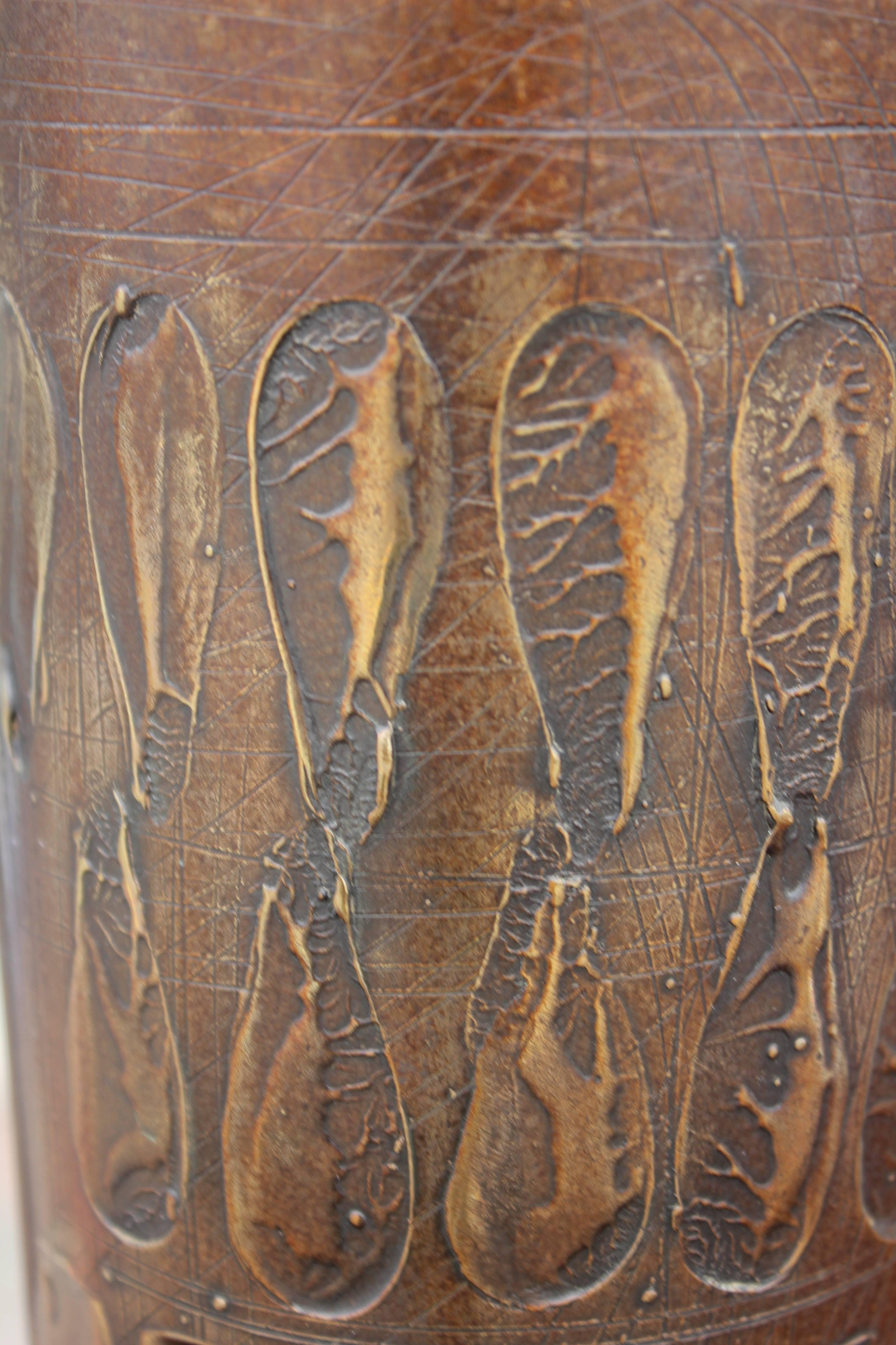 Modern brass flower vase with abstract impressions made by and signed by Shatsby. The brass is solid and has a wonderful natural patina. 