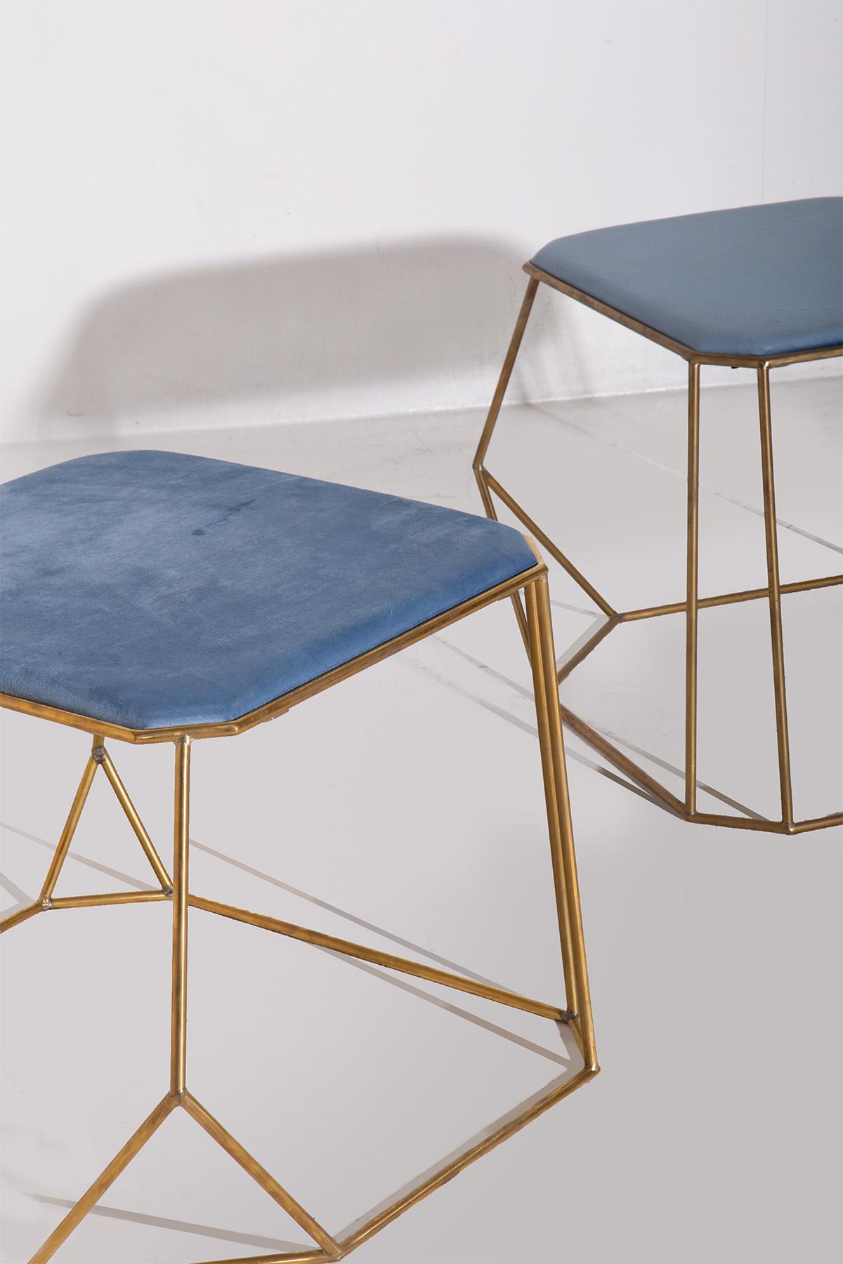 Immerse yourself in the elegance of modern design with this exquisite pair of stools, skillfully crafted to blend utility with aesthetic pleasure. The stools showcase a sturdy, tubular brass frame, each line and curve engineered to create an