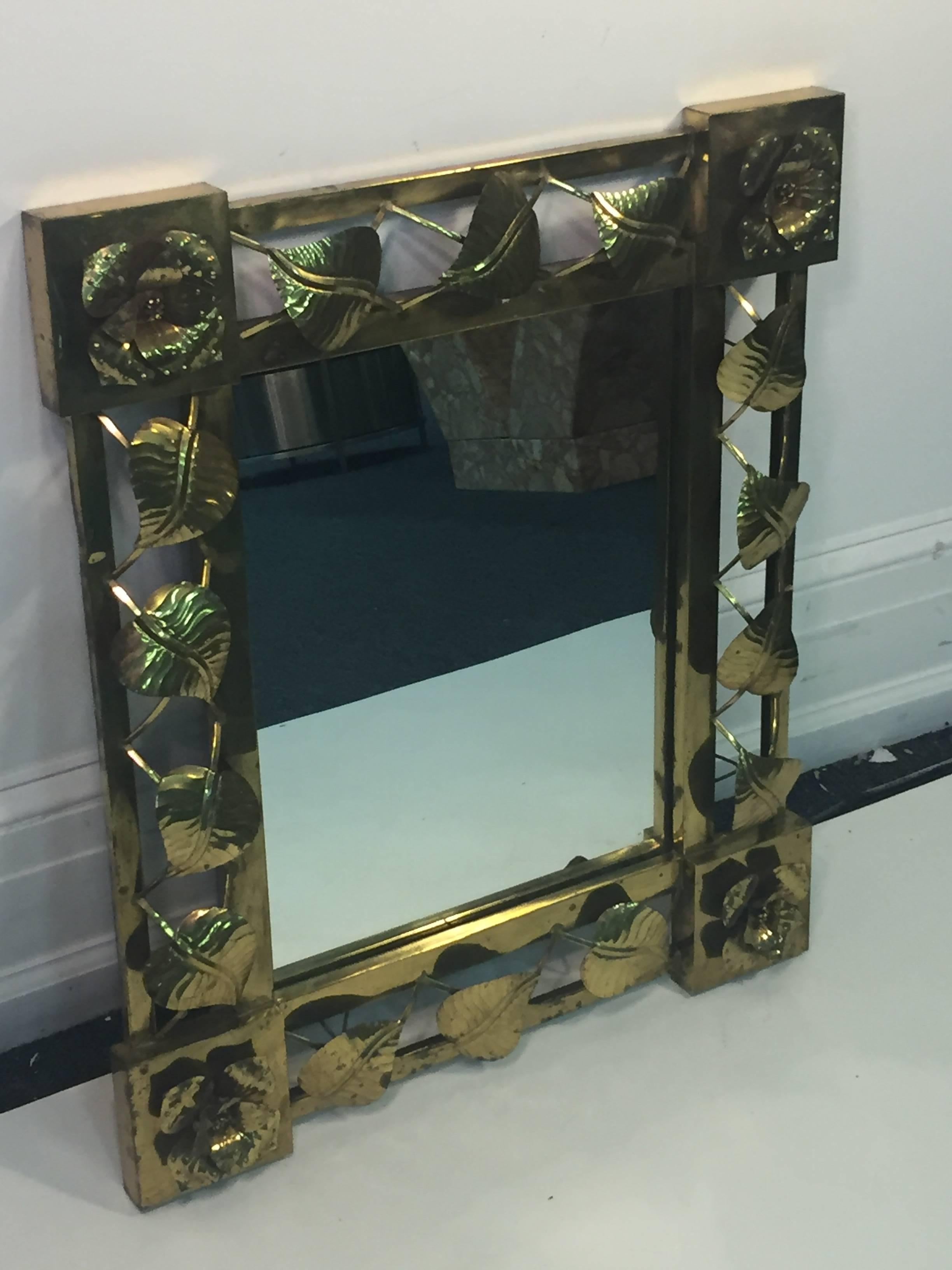 Modernist hand formed flower and leaf brass mirror in three dimensional form designed in Mexico in the 1970s.
Decorative and well constructed in form. Can be hung vertically or horizontally with hanging loops in back.
