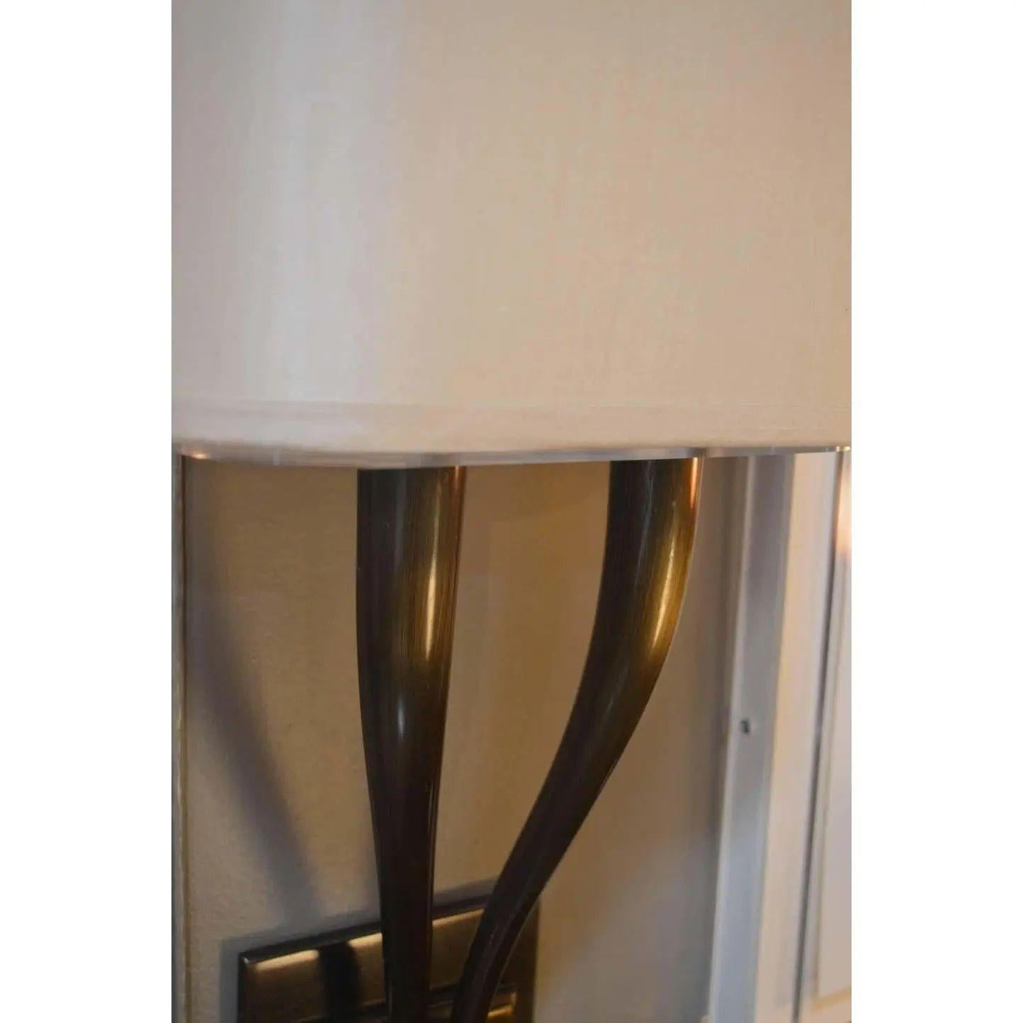 Set of four modern brass two armed sconces. Lightly used, very light scratches or minor cosmetic wear, but has no structural issues.