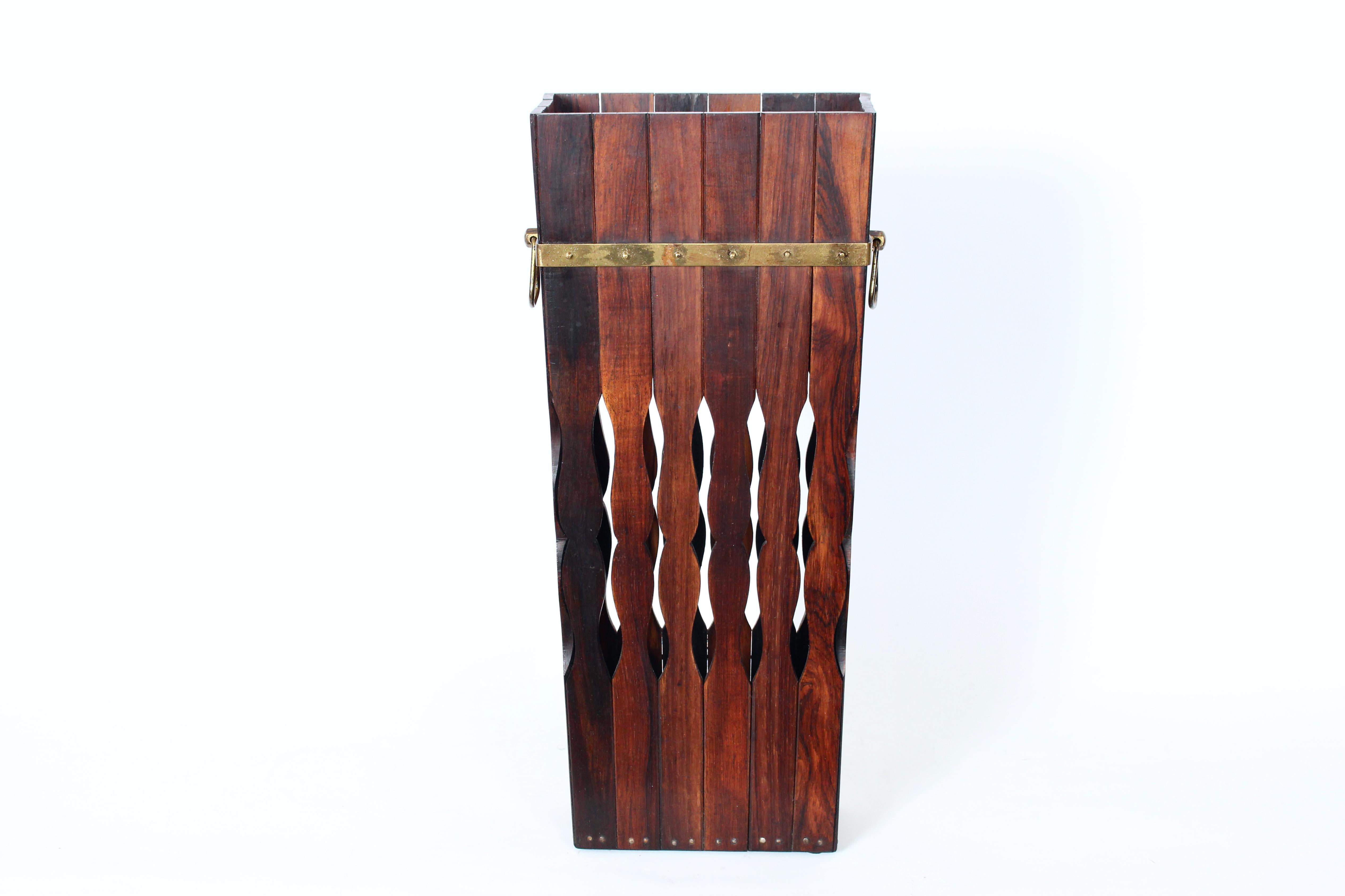 Modernist Brass Handled Brazilian Rosewood Umbrella Stand. Cane Stand. Featuring cut-out Rosewood slats, patinated Brass banding, nailhead stud accents, detailed with Brass handles. Base (7.75W x 4D). Sturdy. Balanced. Fine design. Made in Brazil by