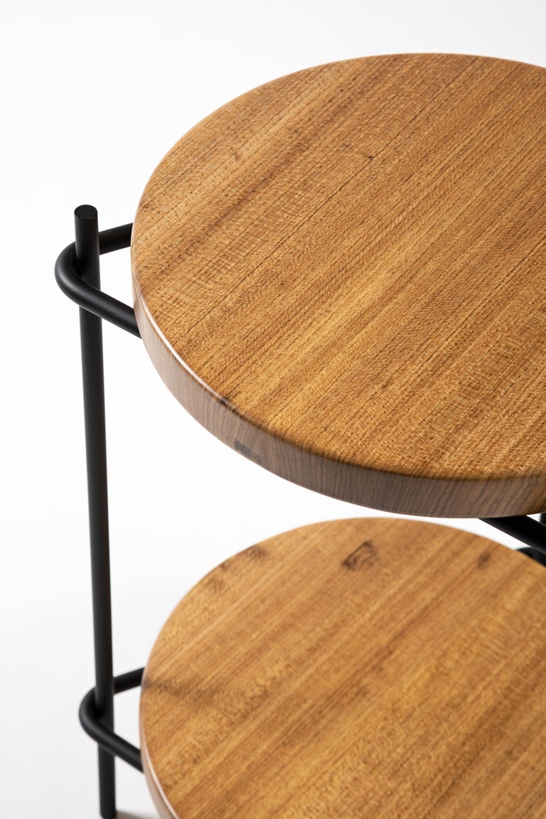 This versatile modern side table in solid Brazilian wood 