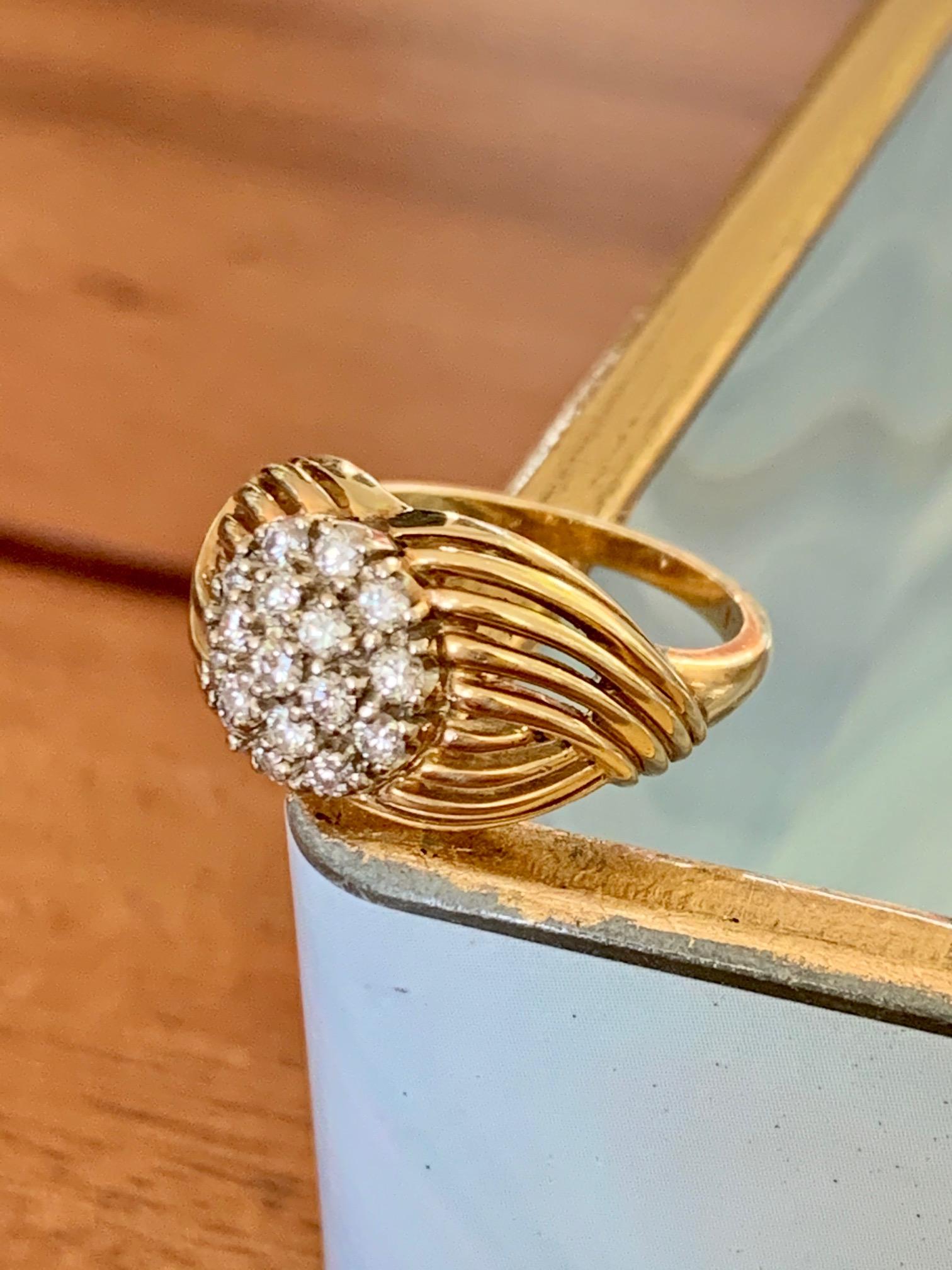 This 18 karat yellow Gold ring features seventeen 2.2mm brilliant cut Diamonds totaling approximately 1.0 tcw. 
Average clarity and color: VS-G
Size: 6
Weight: 6.2 grams