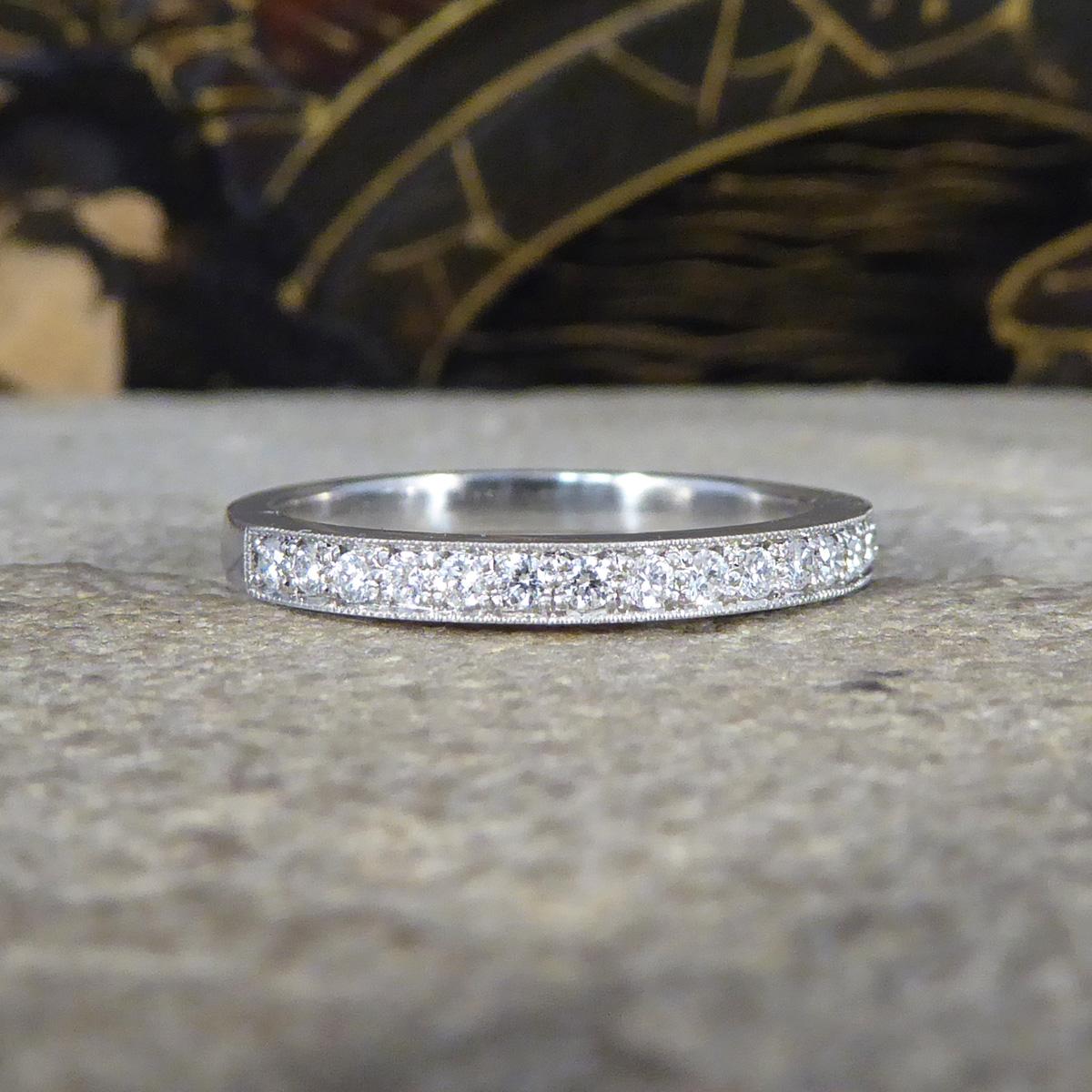 The perfect ring for anyone who likes a little sparkle on the finger, it can be worn independently, as a wedding or eternity band. This quality half eternity ring features 16 very clean and bright Brilliant Cut Diamonds weighing a total of 0.19ct it