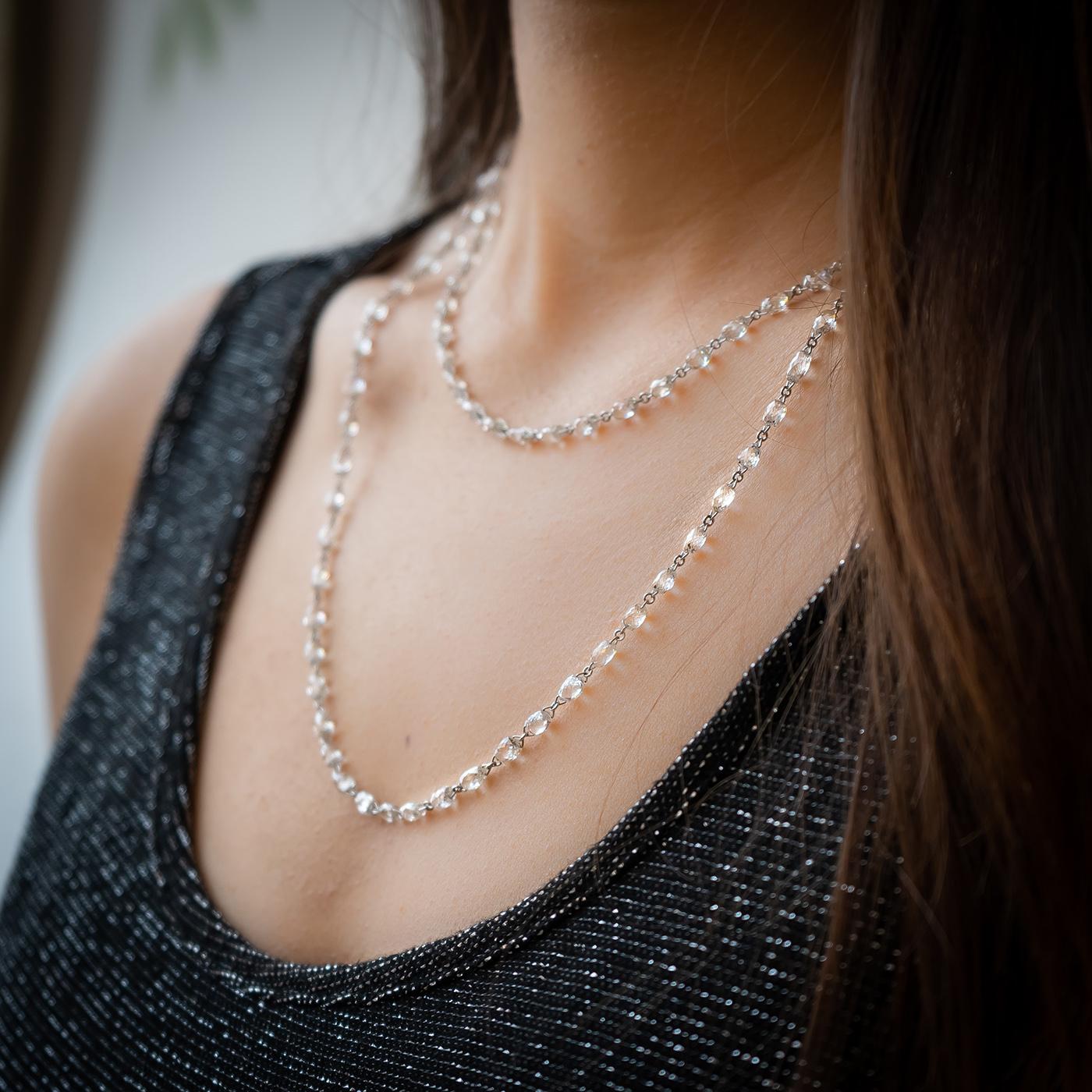 A modern briolette diamond long necklace, with 83, briolette-cut diamonds, weighing an estimated total of 36.83ct, with chain link between, mounted in 18ct white gold, with a white gold lobster clasp. This necklace sparkles when worn as the diamonds